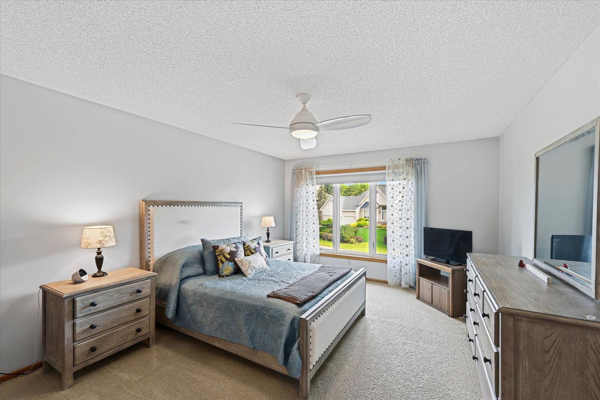 11412 Louisiana Avenue S, Bloomington, MN 55438 The generously sized primary bedroom offers plenty of room for a comfortable bedroom setup along with convenient access to the private bath and walk-in closet.
