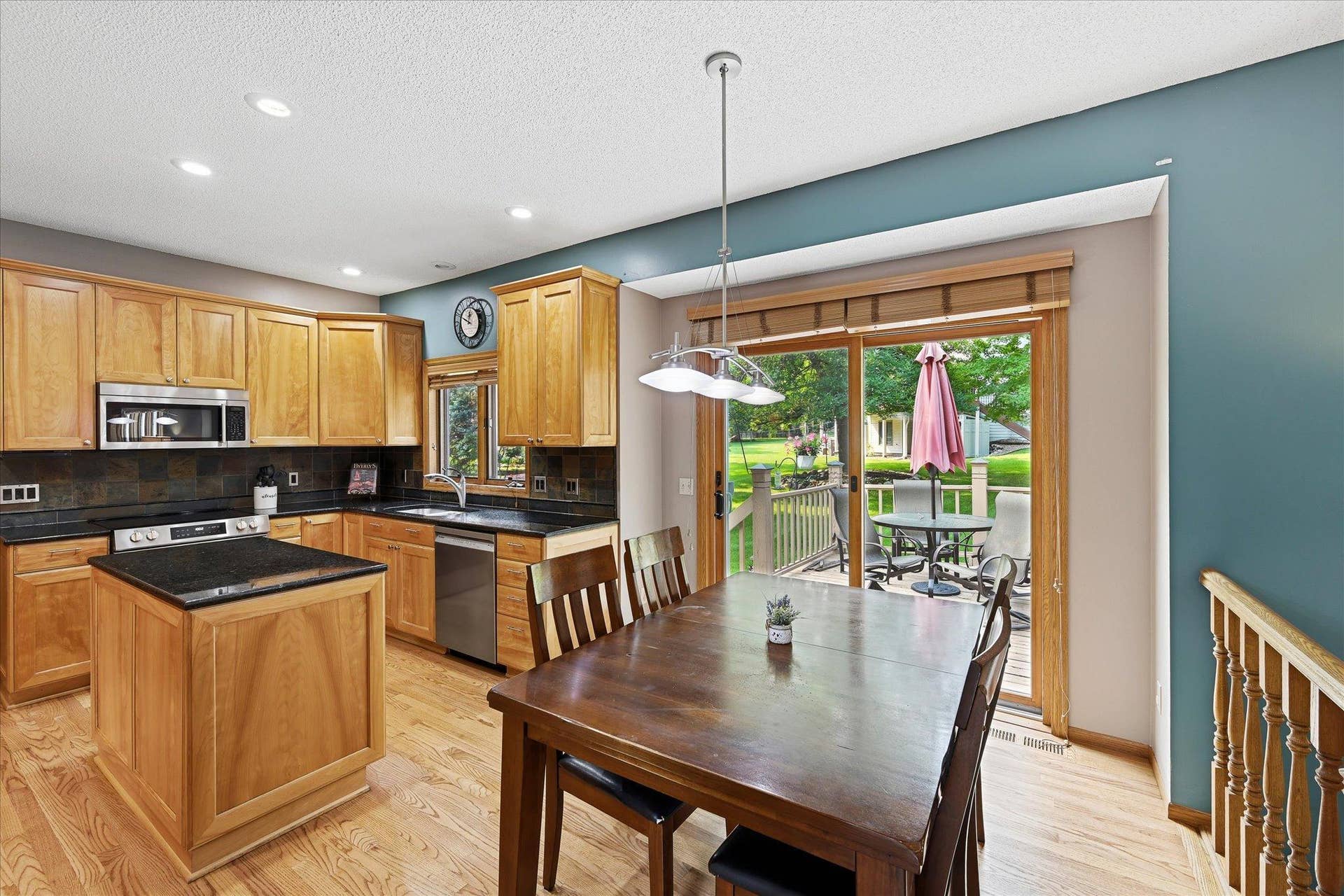 11412 Louisiana Avenue S, Bloomington, MN 55438 The kitchen flows naturally into the informal dining area, with direct access to the deck and backyard.