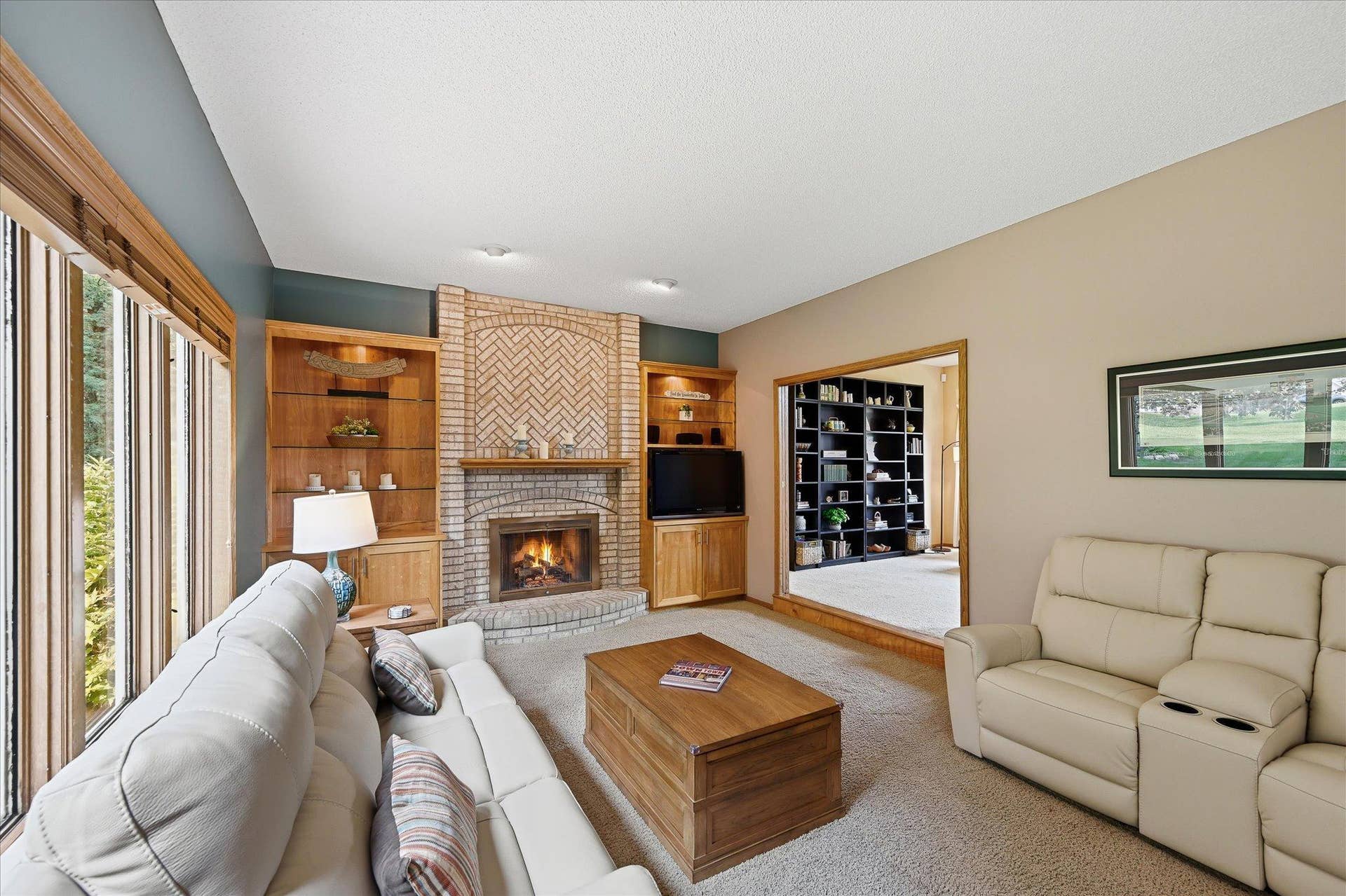 11412 Louisiana Avenue S, Bloomington, MN 55438 A fireplace and built-in cabinetry create a natural focal point in the spacious family room.