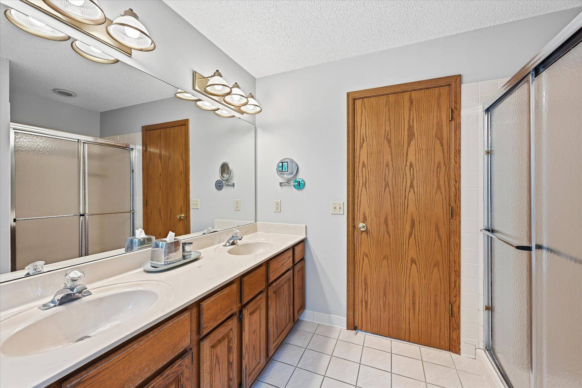 11412 Louisiana Avenue S, Bloomington, MN 55438 The private primary bath features a separate tub and shower, creating a functional and comfortable retreat.