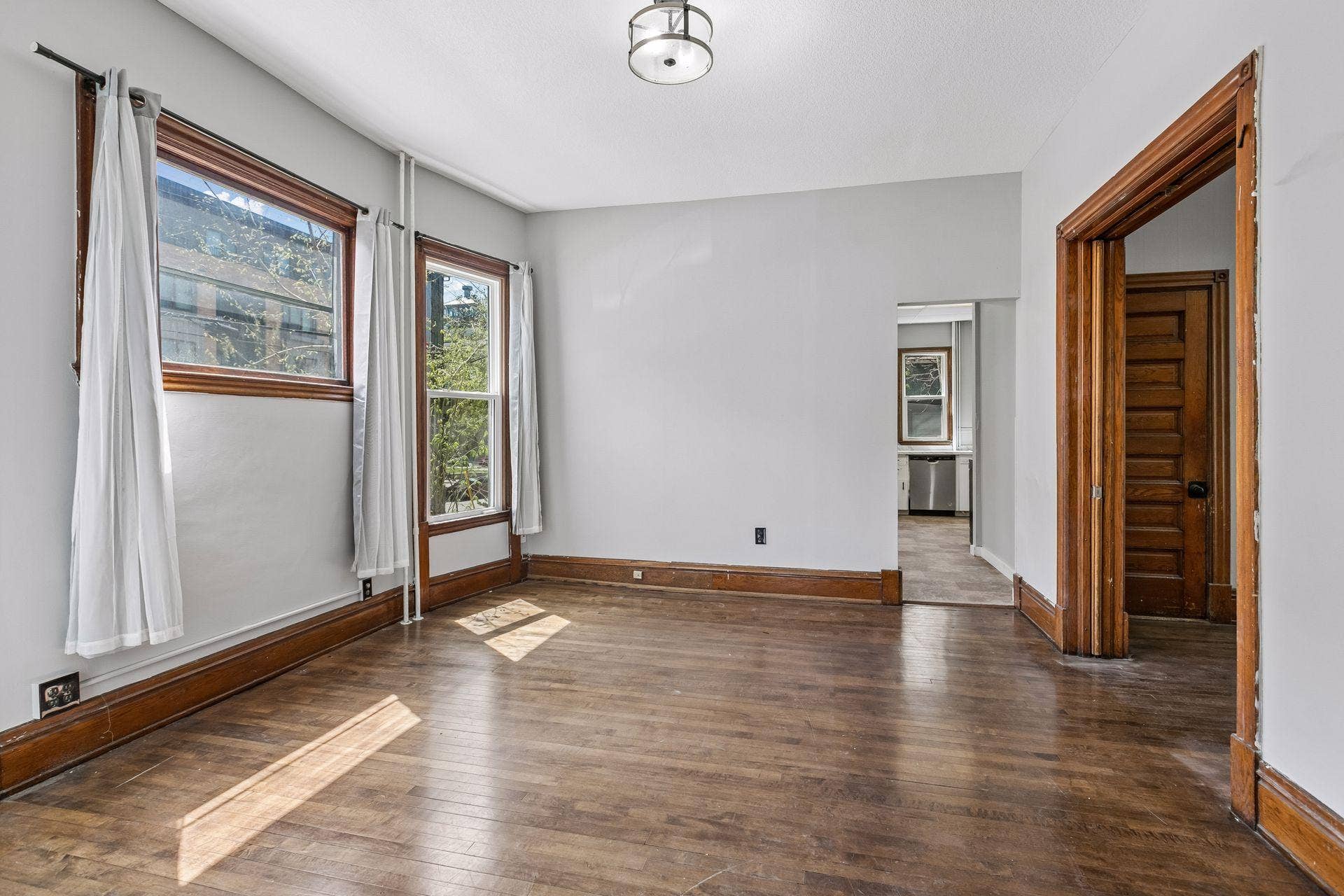 1300 Grand Street NE, 68, Minneapolis, MN 55413 This classic property features three units spanning across 3,313 finished square feet. Unit 1 (main floor) includes a full kitchen, living room, two bedrooms, and a full bathroom.