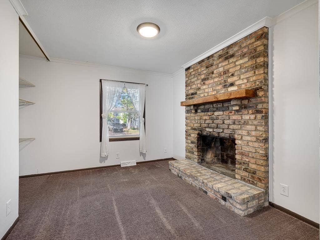 4954 Grenwich Trail N, Oakdale, MN 55128 There are large sliding doors once closed create this a second bedroom.