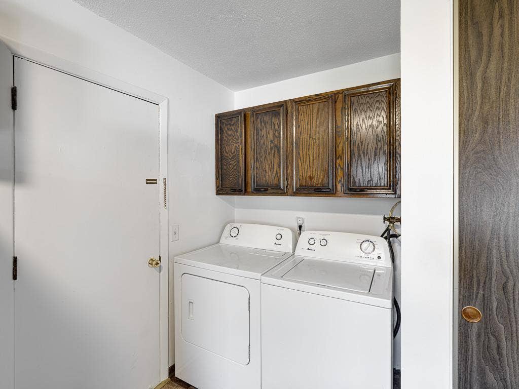 4954 Grenwich Trail N, Oakdale, MN 55128 The laundry area is conveniently located in the kitchen.