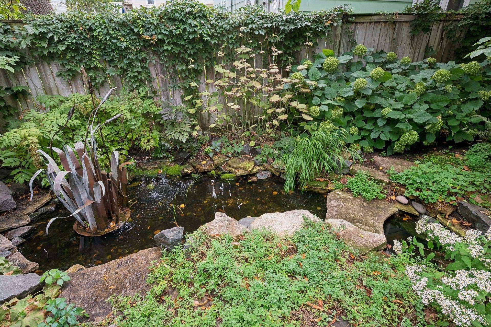 3223 Blaisdell Avenue, 48, Minneapolis, MN 55408 A large pond and water feature add a peaceful element to the backyard.