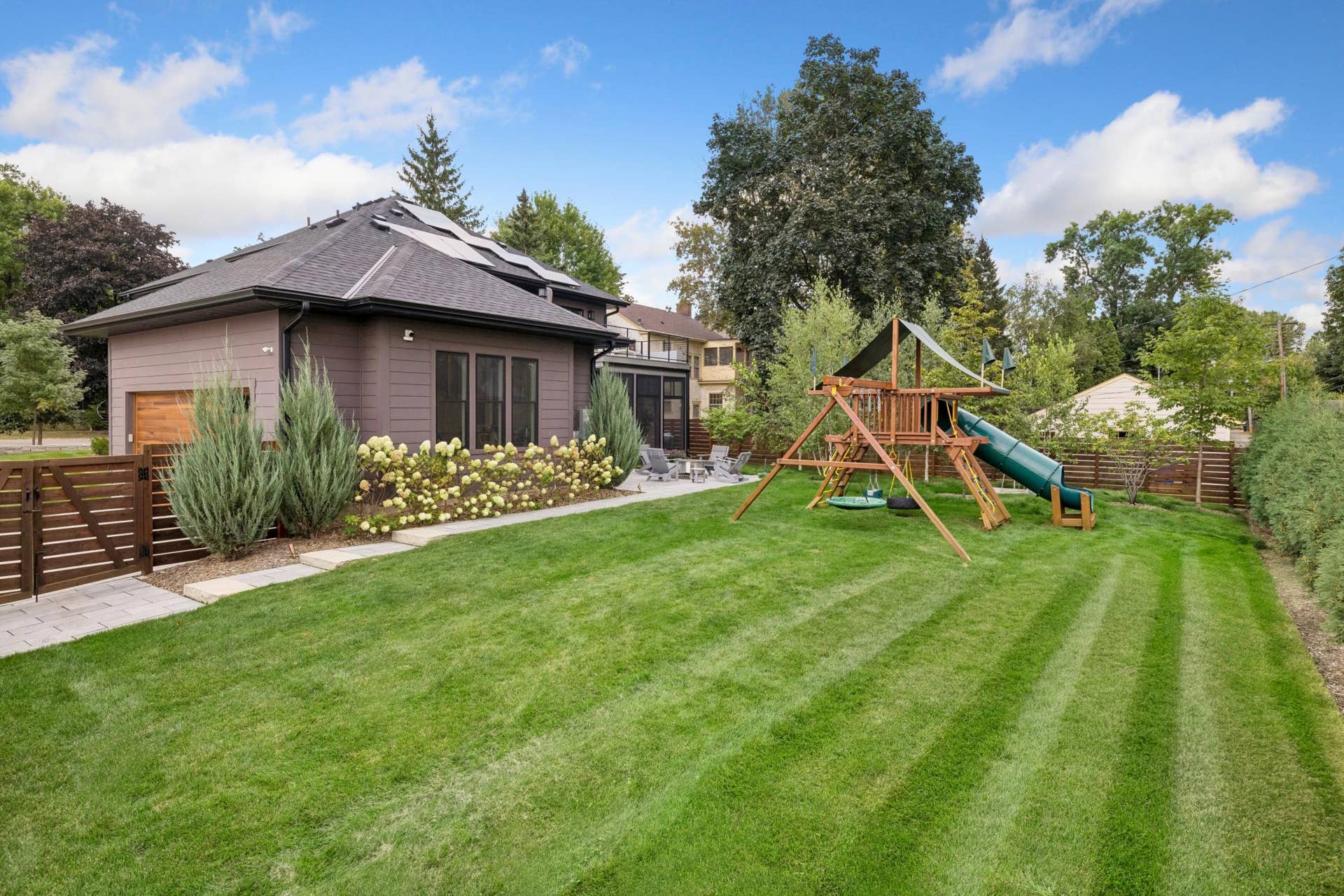 363 Woodlawn Avenue, 95, Saint Paul, MN 55105 Beautifully landscaped backyard with privacy fencing.