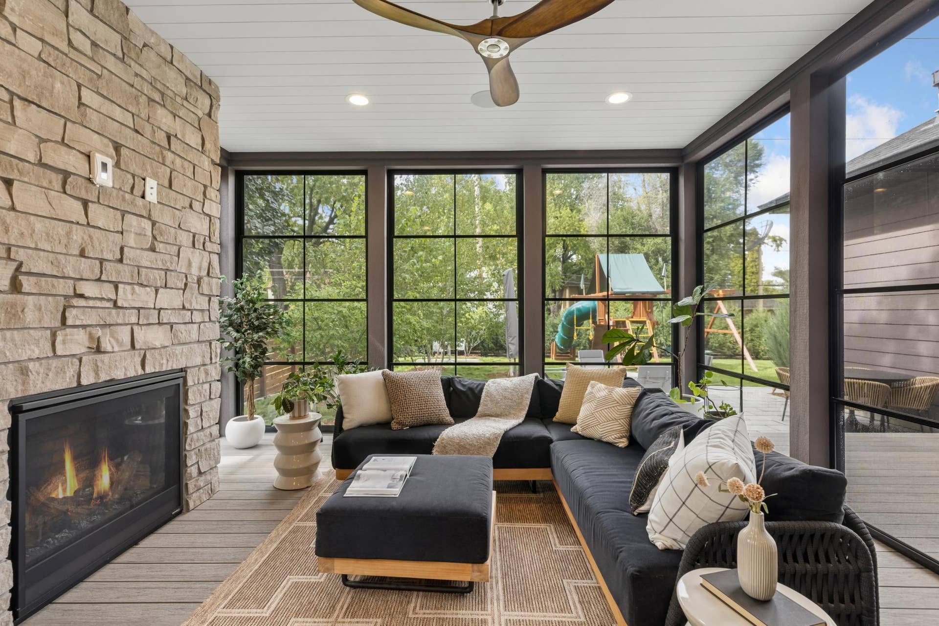 363 Woodlawn Avenue, 95, Saint Paul, MN 55105 Relaxing screened porch with stone fireplace.