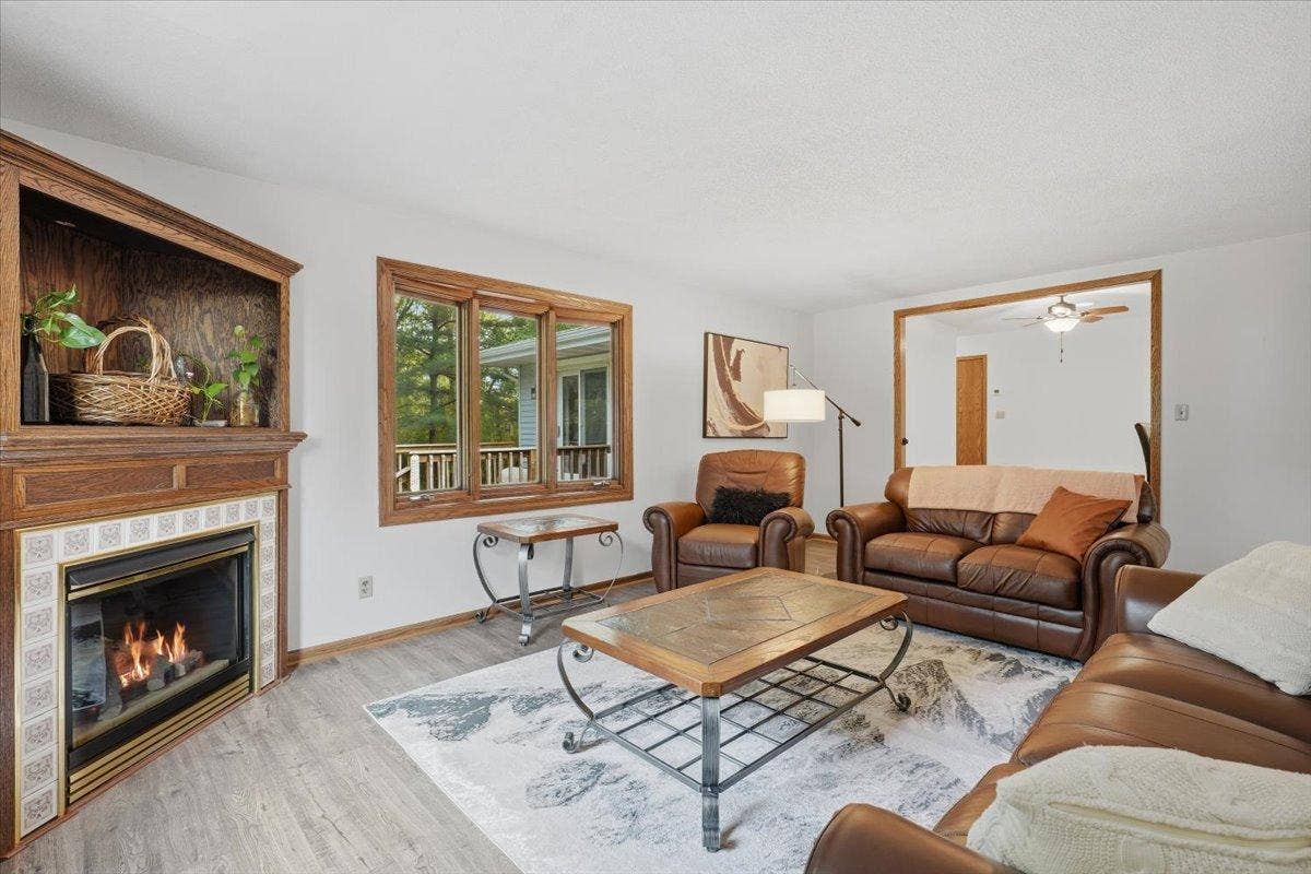 272 Glenmont Road, River Falls, WI 54022 Warm and inviting living room with a cozy fireplace for those chilly evenings.