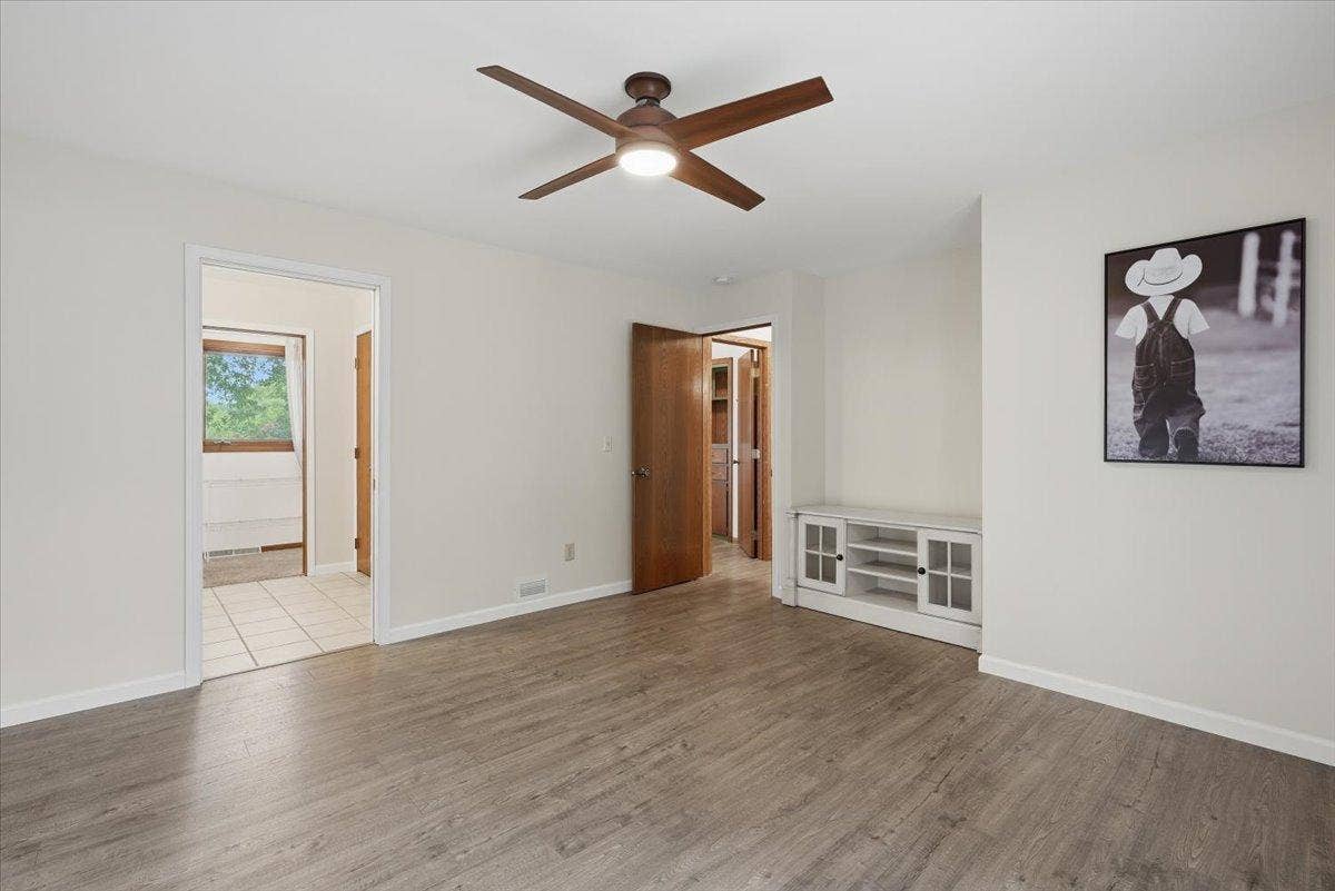 272 Glenmont Road, River Falls, WI 54022 Primary bedroom with private bathroom.