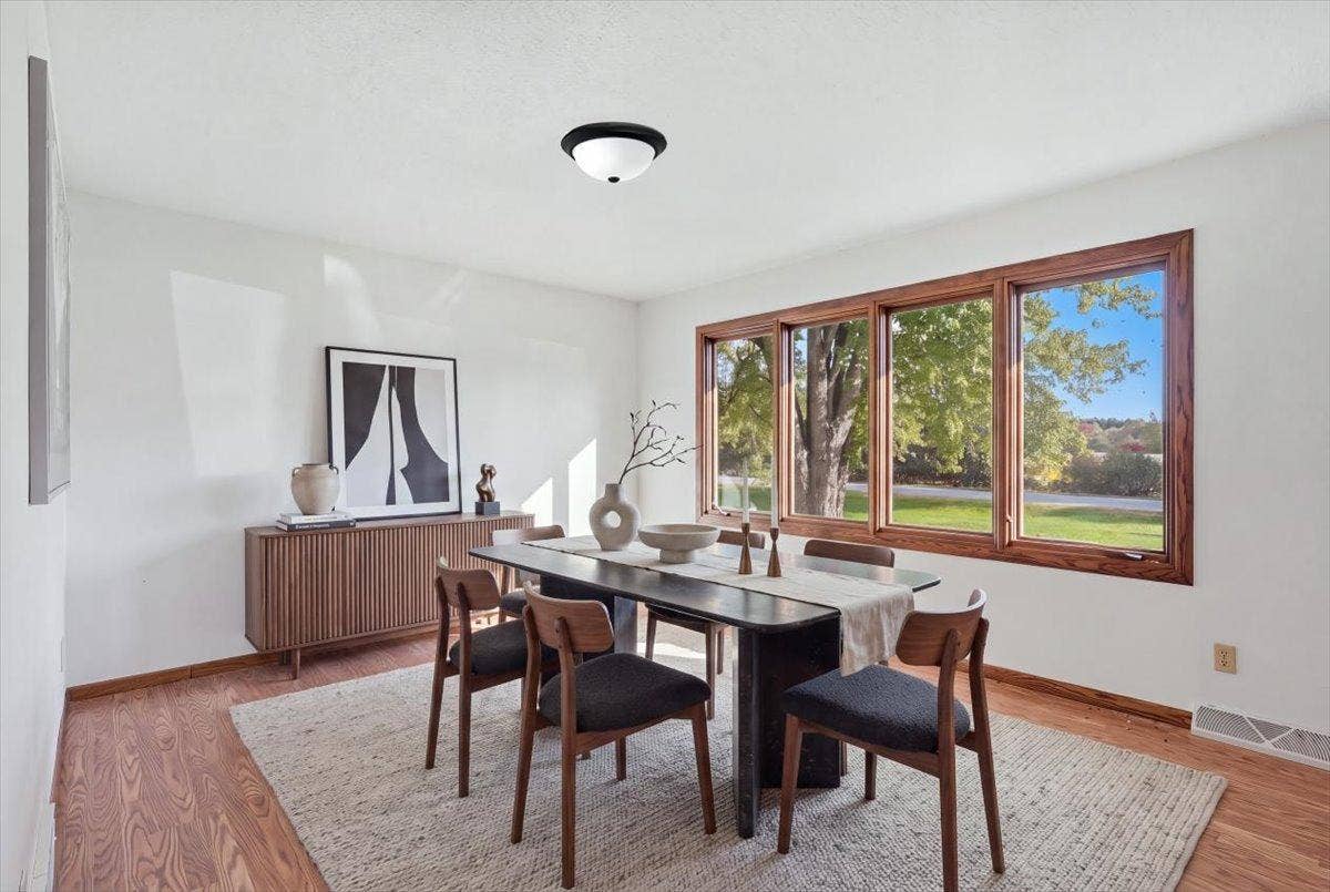 272 Glenmont Road, River Falls, WI 54022 Bright formal dining room with warm wood flooring and beautiful views.