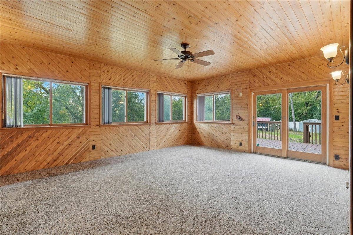 272 Glenmont Road, River Falls, WI 54022 Beautiful sunroom with warm wood accents and plenty of natural light.
