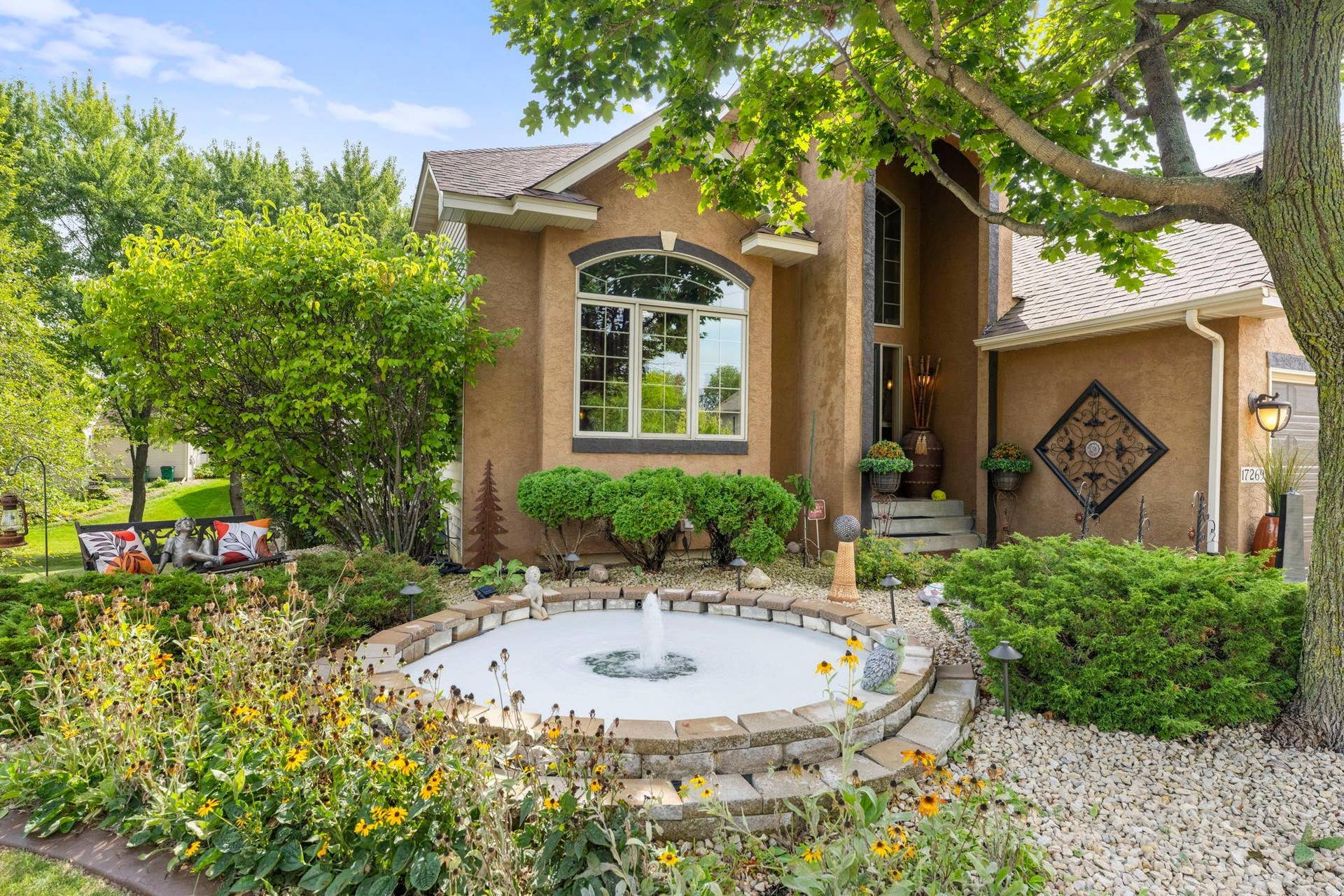 17269 80th Place N, Maple Grove, MN 55311 Outdoor fountain creates an enhanced curb appeal on top of an already unmatched exterior landscaping.