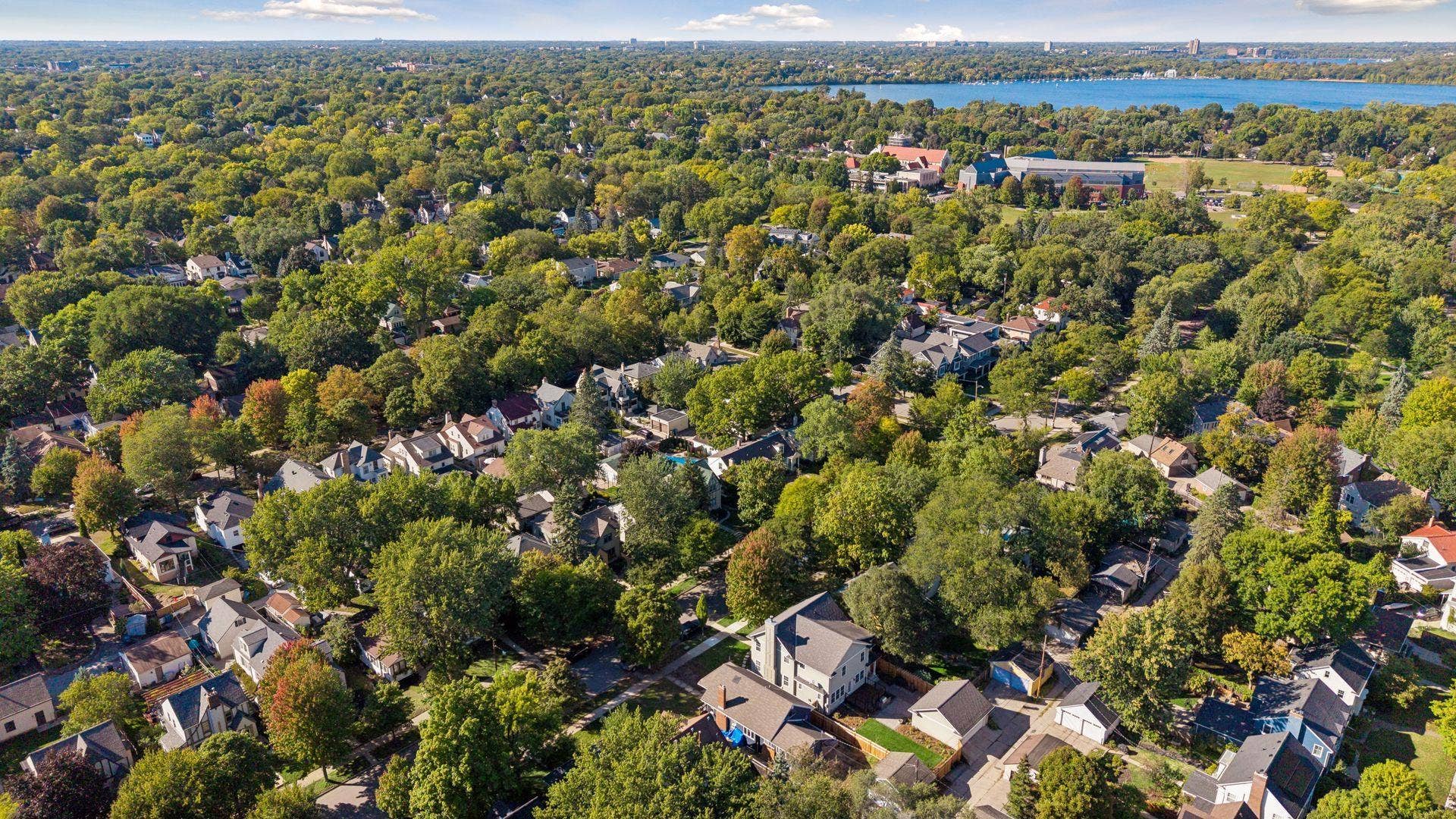 5212 Humboldt Avenue S, 49, Minneapolis, MN 55419 Neighborhood Aerial - Expansive aerial view highlights the homes Southwest Minneapolis location with nearby Lake Harriet visible beyond the surrounding tree-lined neighborhoods.