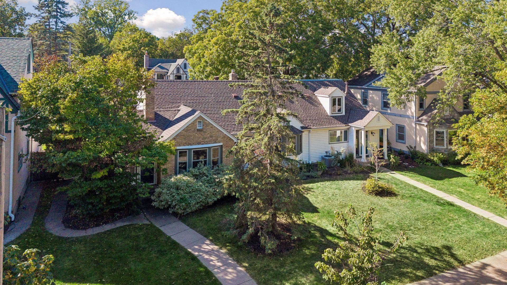 5212 Humboldt Avenue S, 49, Minneapolis, MN 55419 Front Aerial - Elevated view showcases the homes distinctive architecture, mature trees, established landscaping, and its setting among the classic homes of Southwest Minneapolis.