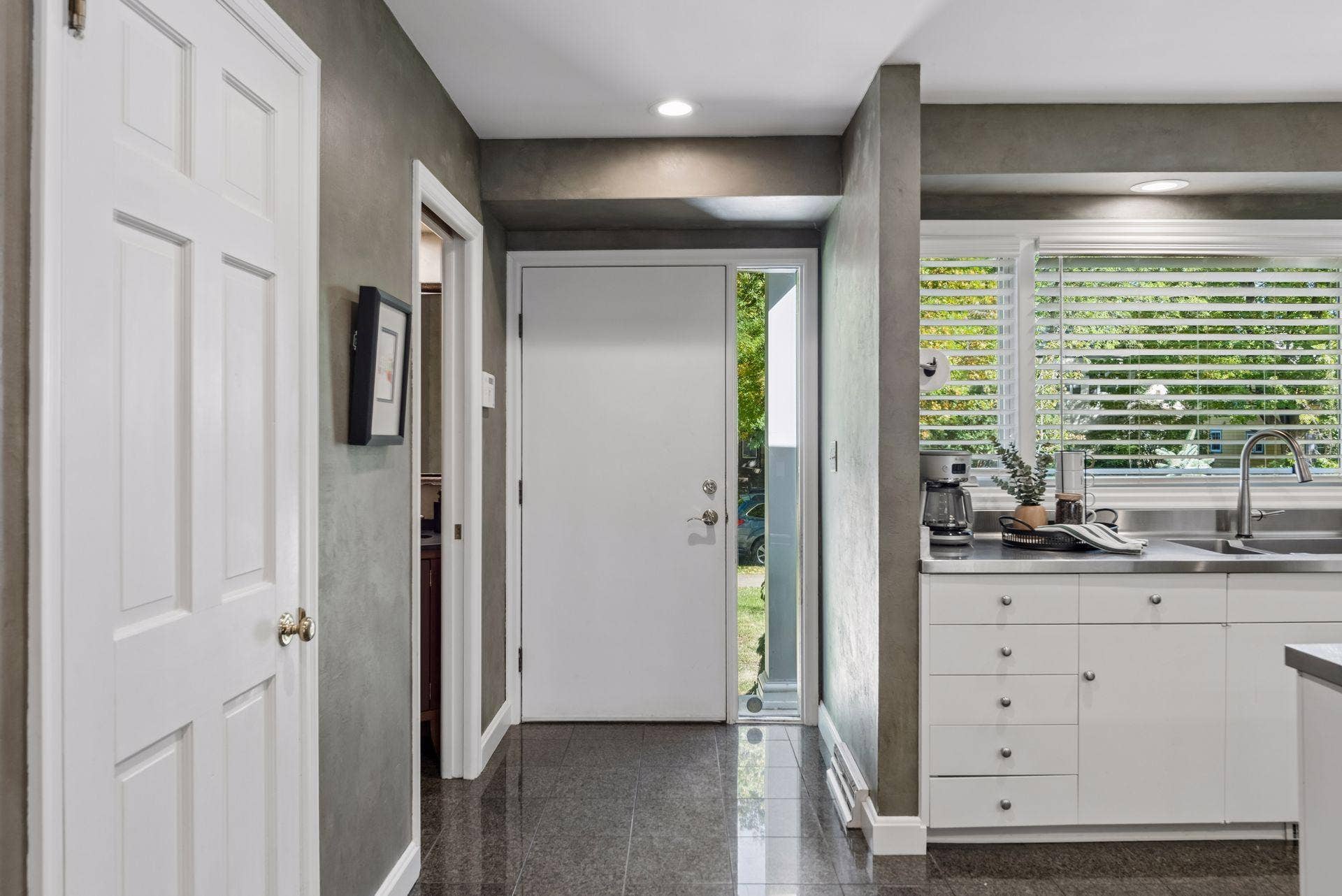 5212 Humboldt Avenue S, 49, Minneapolis, MN 55419 Entry & Kitchen - Front entry opens to tile flooring and a bright kitchen, offering a first look at the homes open, connected main-level layout.