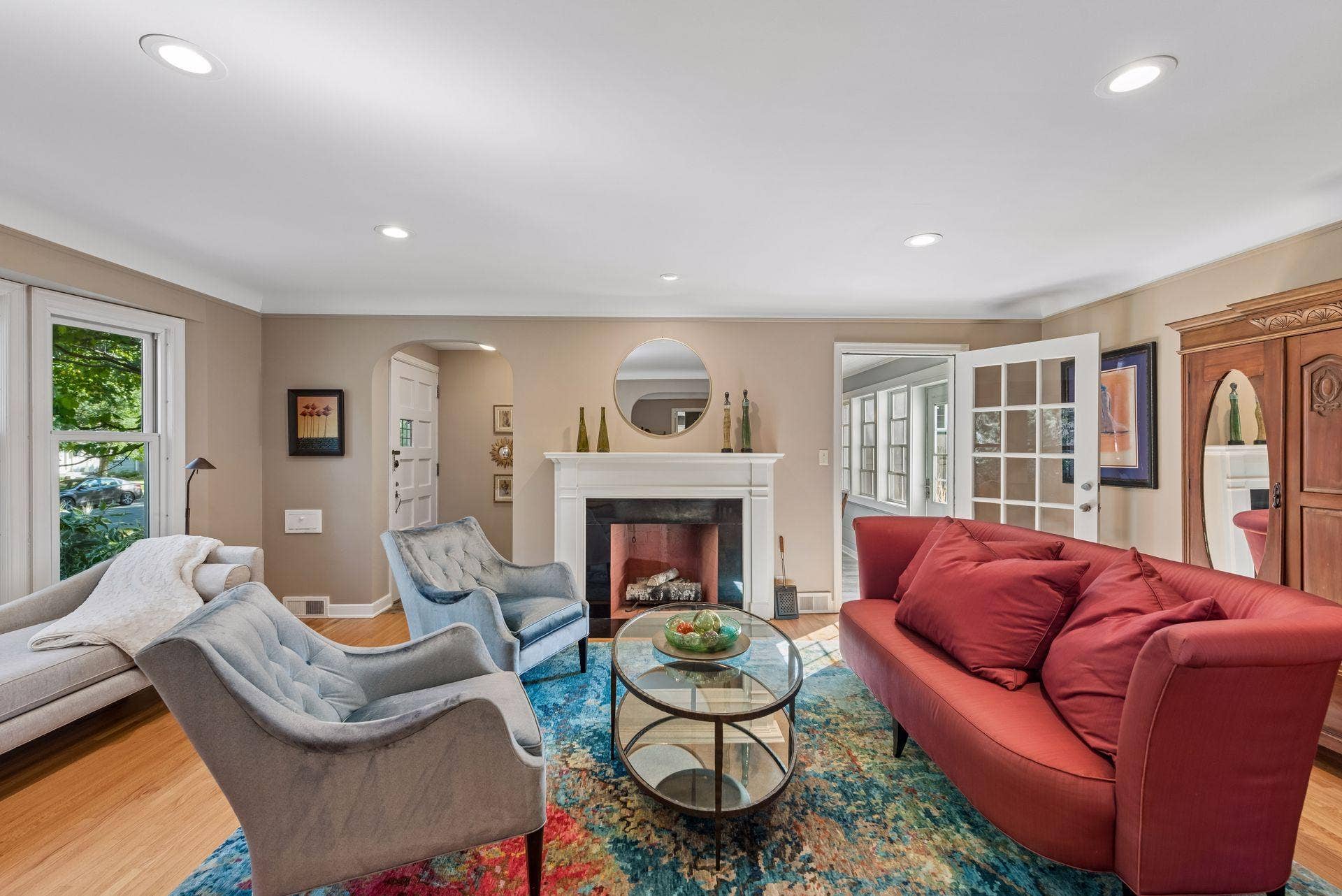 5212 Humboldt Avenue S, 49, Minneapolis, MN 55419 Living Room - Spacious main-level living room centers around a classic fireplace with white mantel, complemented by hardwood floors, recessed lighting, and large windows.