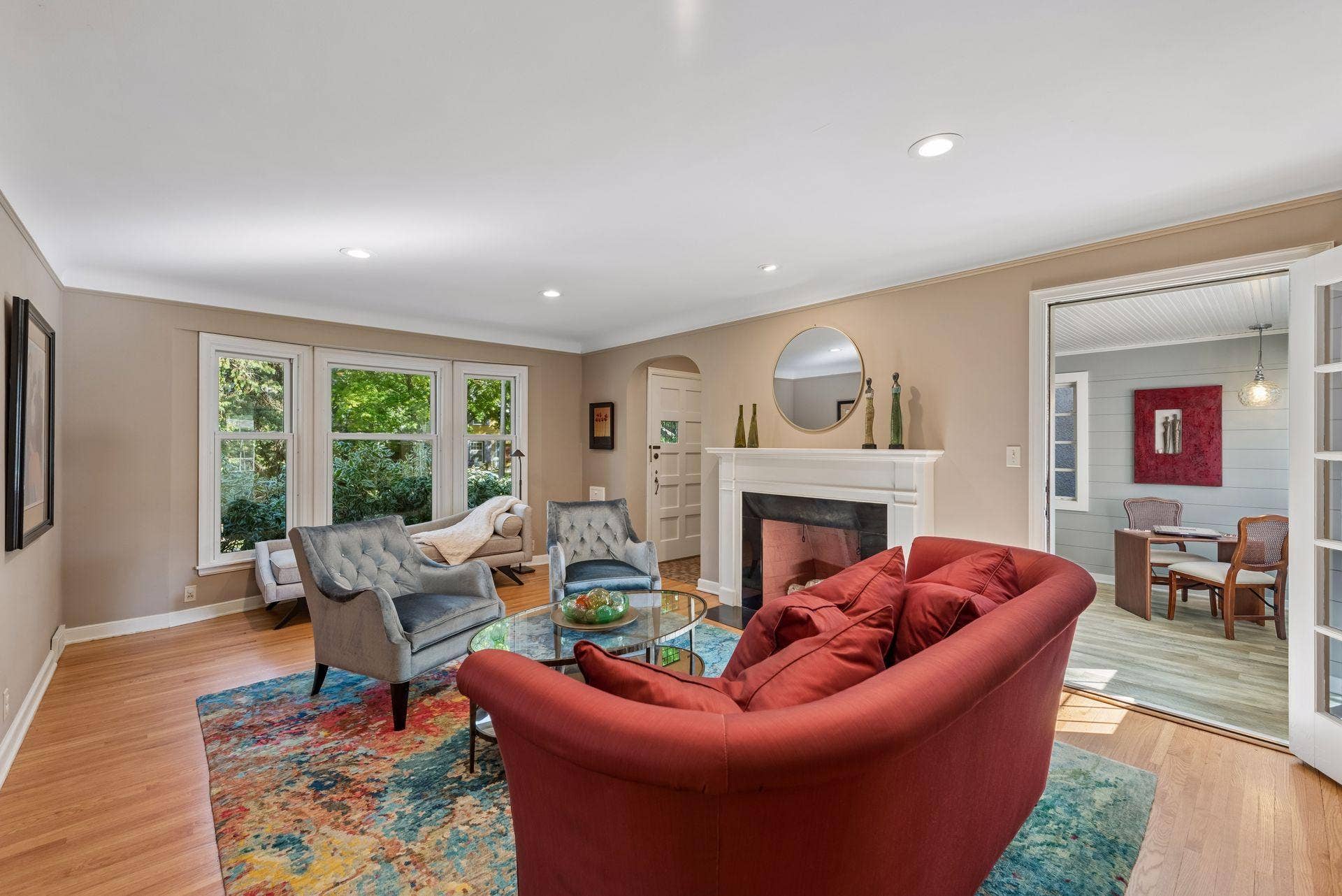 5212 Humboldt Avenue S, 49, Minneapolis, MN 55419 Living Room - Large windows bring natural light into the living room, while the fireplace provides a central focal point. French doors connect directly to the adjoining sunroom.
