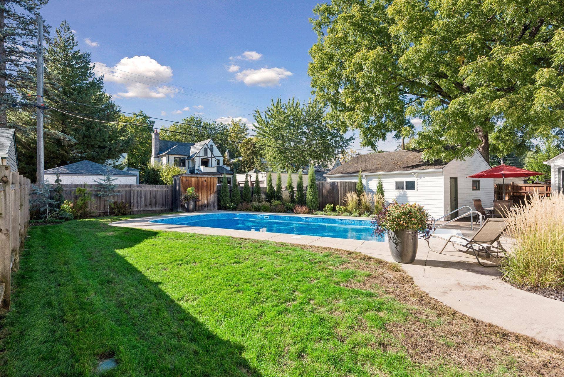 5212 Humboldt Avenue S, 49, Minneapolis, MN 55419 Backyard & Pool - Private fenced backyard features a large in-ground swimming pool surrounded by patio space, mature landscaping, lawn, and a detached garage.
