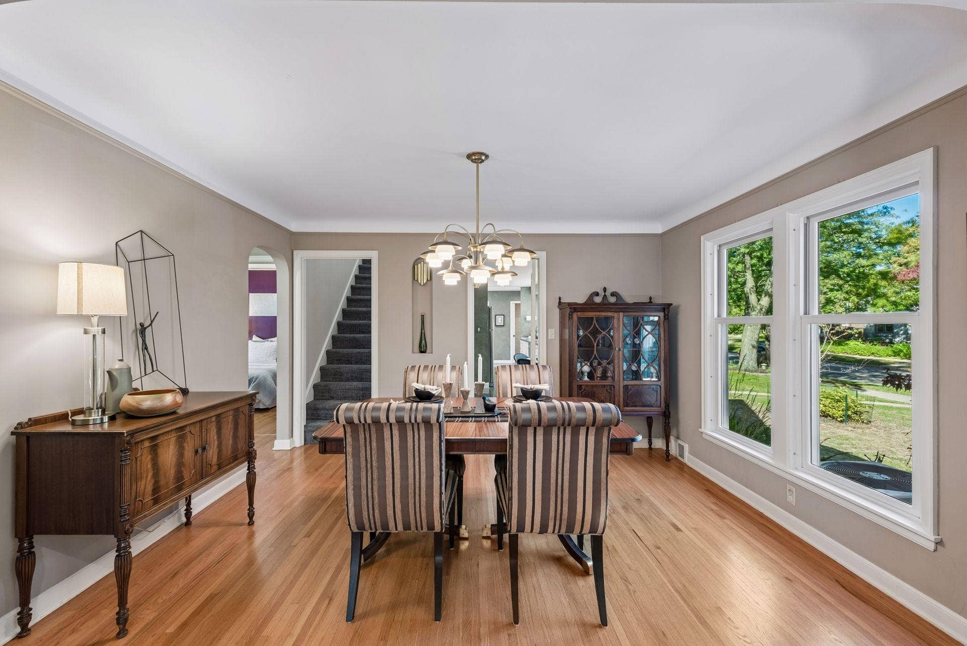 5212 Humboldt Avenue S, 49, Minneapolis, MN 55419 Formal Dining Room - A spacious dining room with hardwood floors, large windows, and plenty of room for a full dining set. Nearby openings provide easy access to the kitchen, stairs, and adjoining bedrooms and full bath.