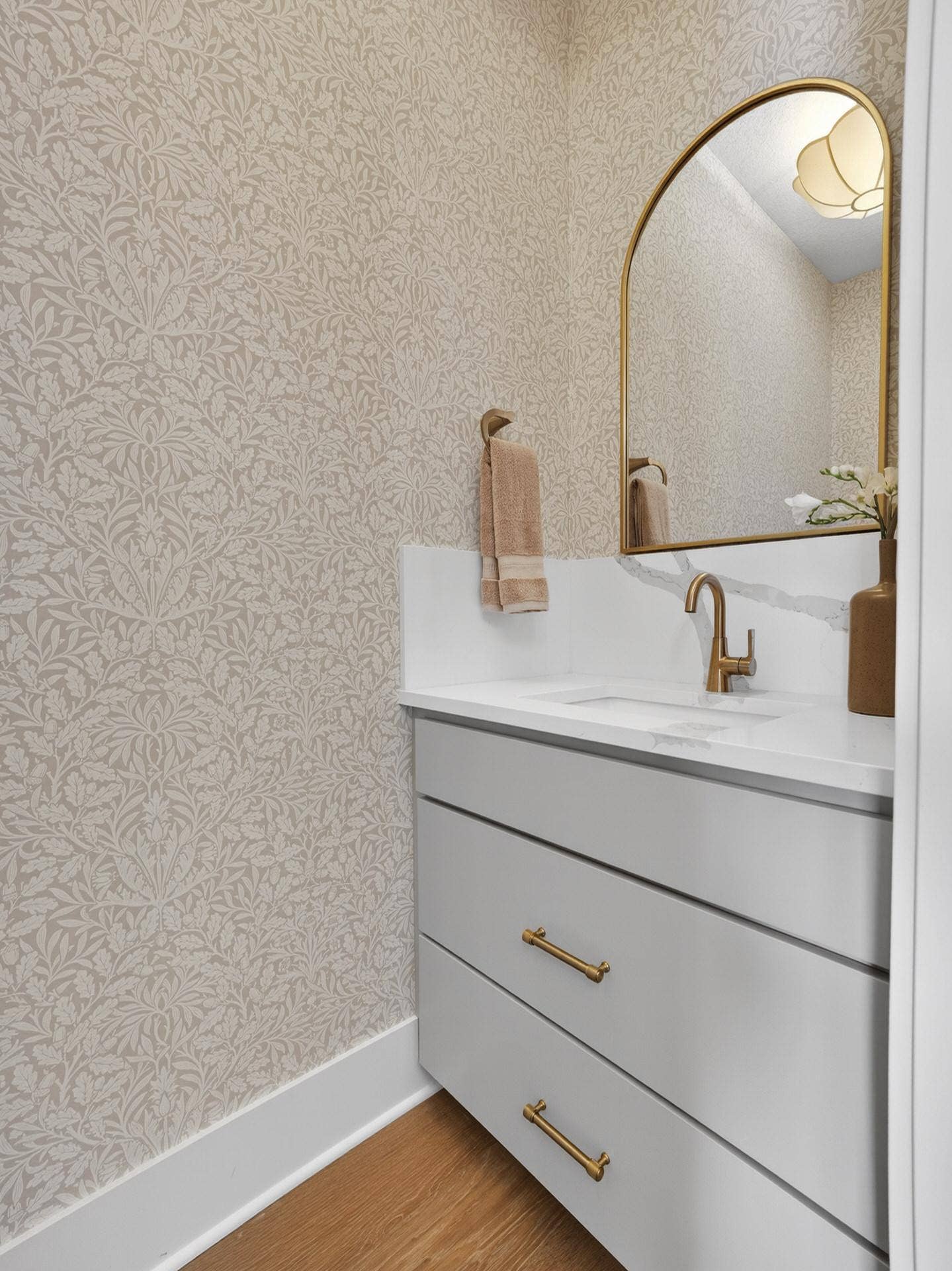 6295 134th Street N, Hugo, MN 55038 Powder bath with stunning wall paper and 12" quarts splash