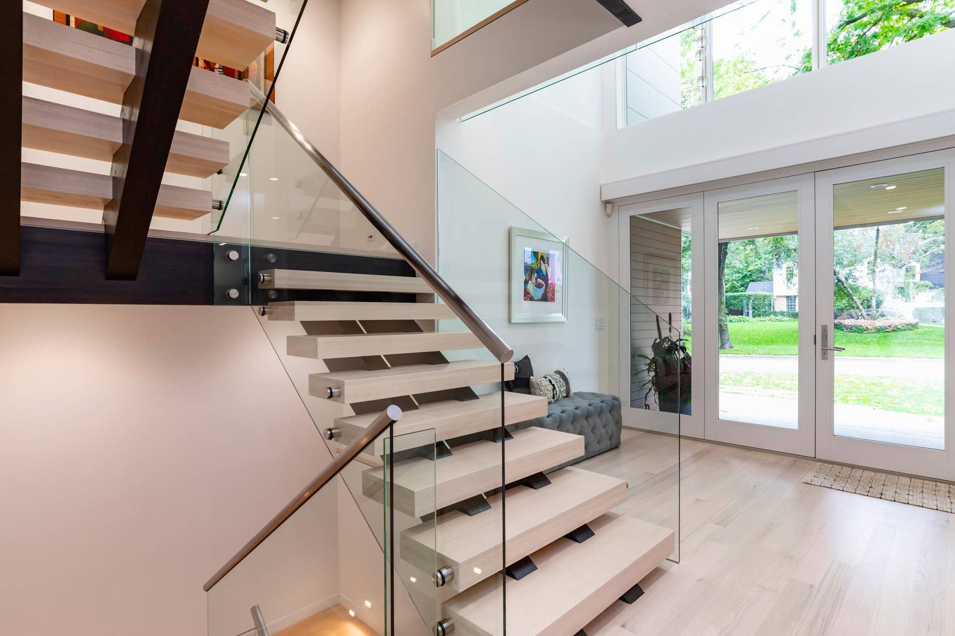 674 Montcalm Place, 94, Saint Paul, MN 55116 The focal point of the main floor is the custom floating staircase, which is carried across all four levels.
