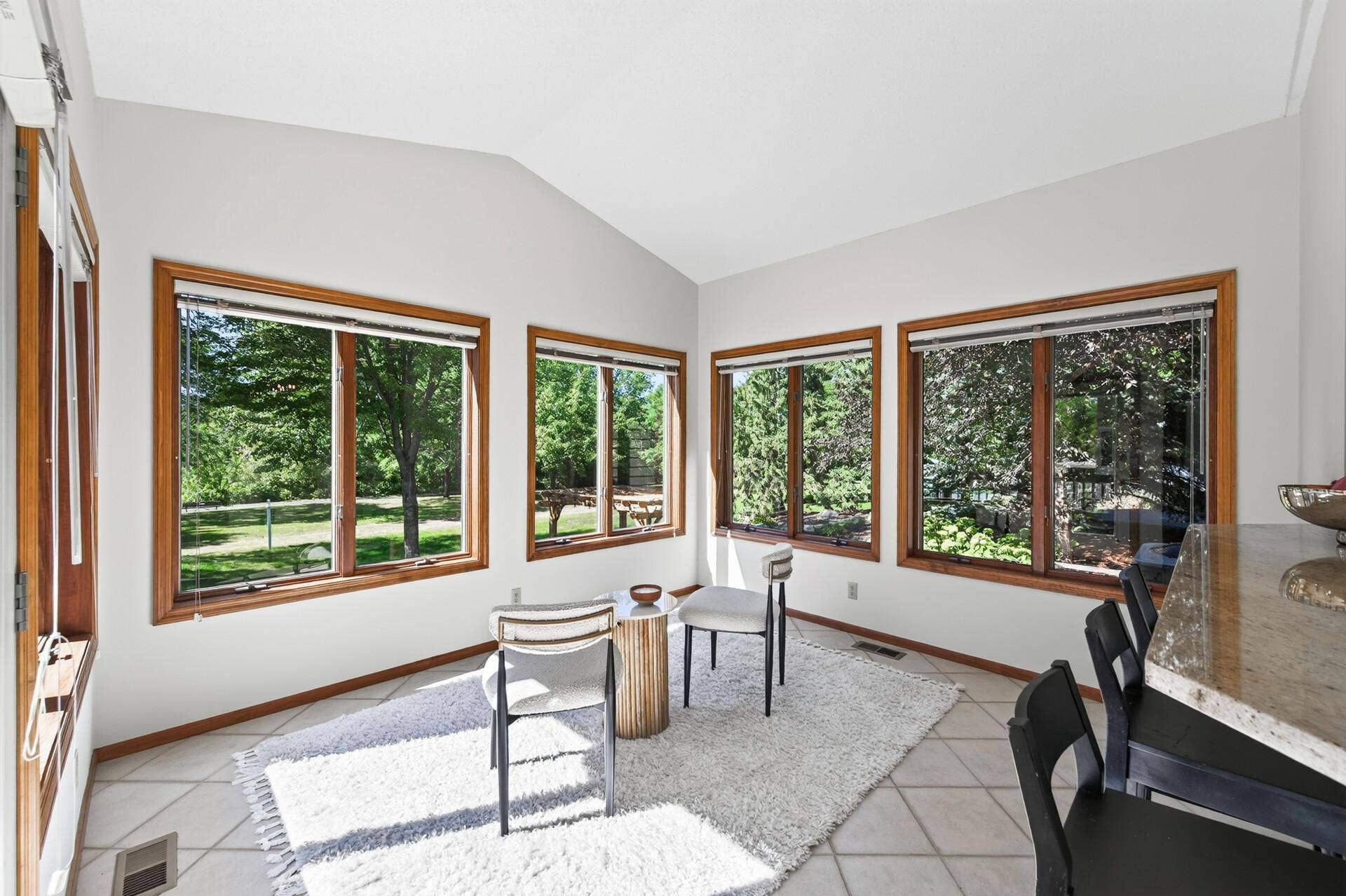 3034 Edgewater Drive, Woodbury, MN 55125 sun room overlooking the lake