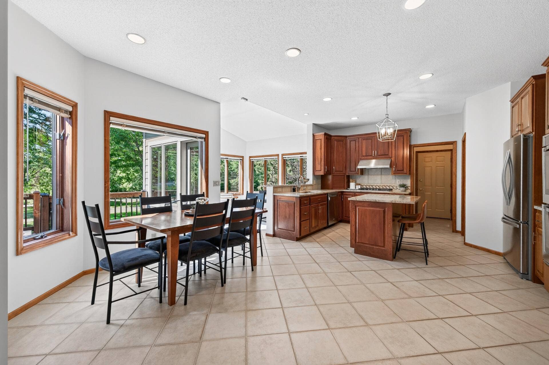 3034 Edgewater Drive, Woodbury, MN 55125 wide open and seating for 11 BEFORE The dining room