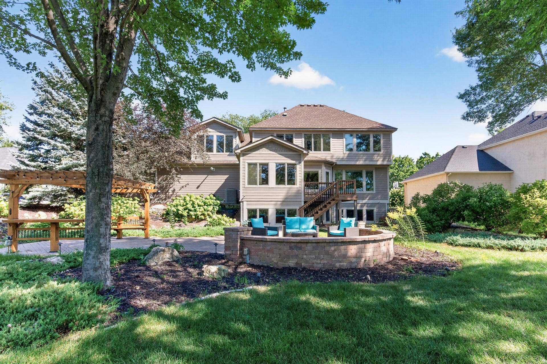 3034 Edgewater Drive, Woodbury, MN 55125 back yard has beautiful landscape lighting