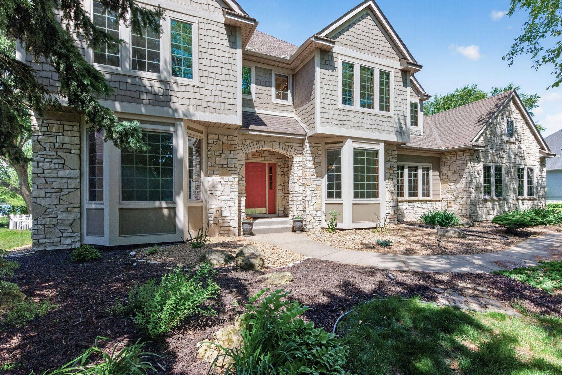 3034 Edgewater Drive, Woodbury, MN 55125 Commanding front presence