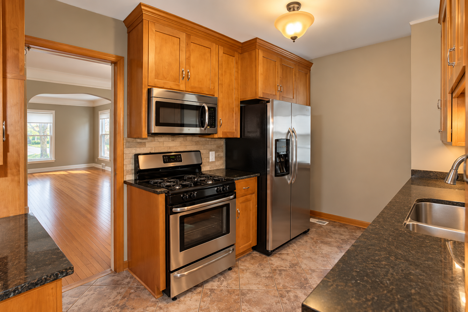 5921 Chicago Avenue S, 17, Minneapolis, MN 55417 A long counter provides generous prep space beside the sink. The gas range, stainless steel appliances and direct connection to the dining room make this kitchen practical for cooking and serving.