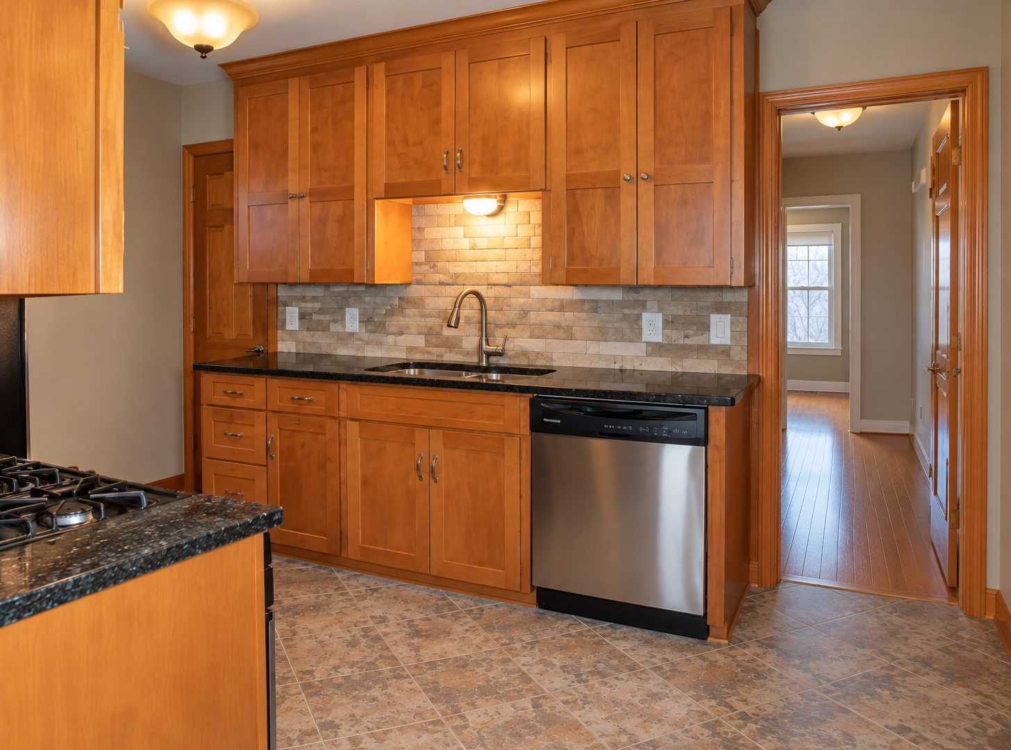 5921 Chicago Avenue S, 17, Minneapolis, MN 55417 Spread out and enjoy cooking in 5921 kitchen. Generous counters give you room to prep, plate and serve, while wood cabinetry keeps cookware close at hand. A gas range, dishwasher and tile backsplash round out 5921s kitchen.