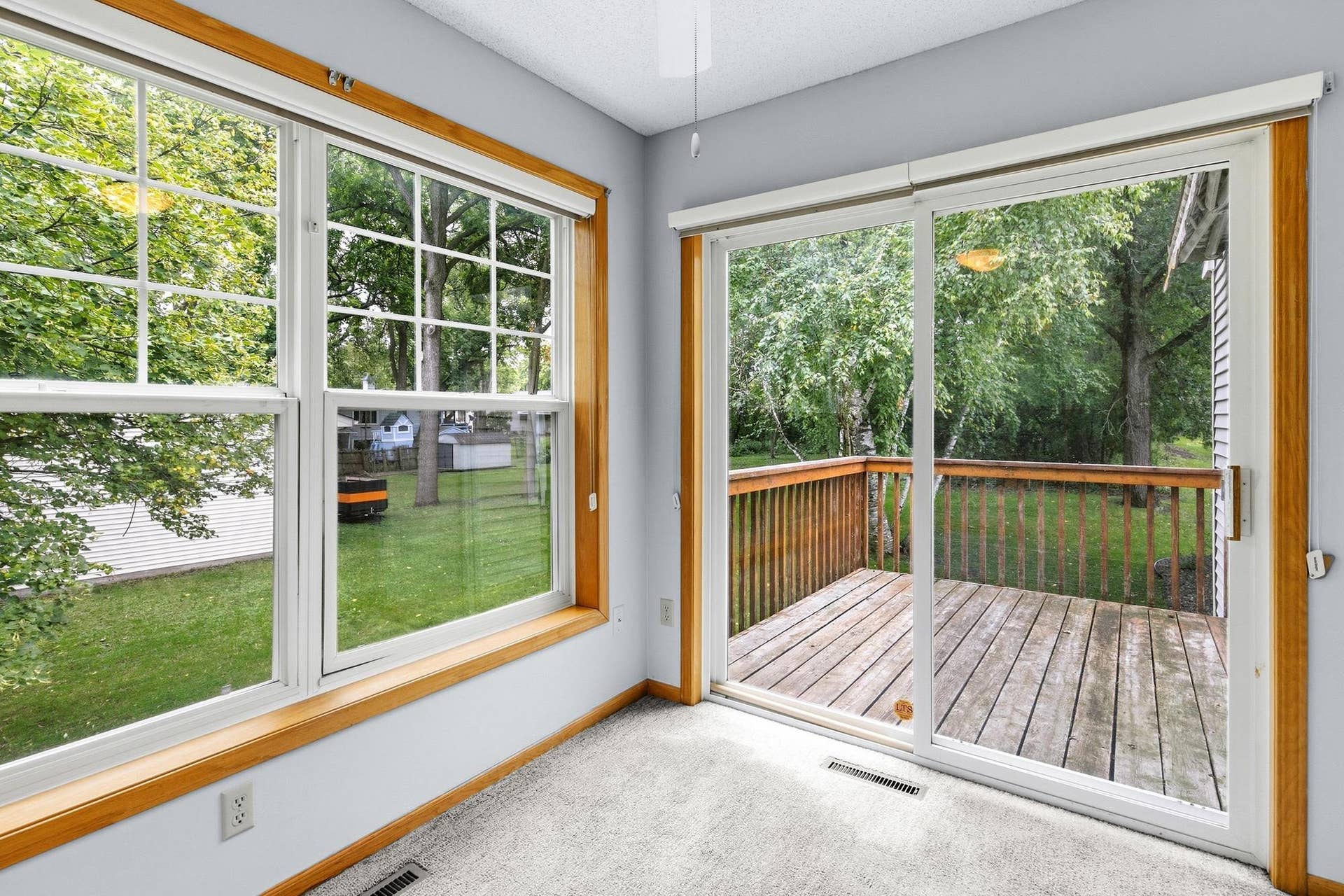 3848 Linden Avenue, White Bear Lake, MN 55110 Sunroom with adjoining deck.