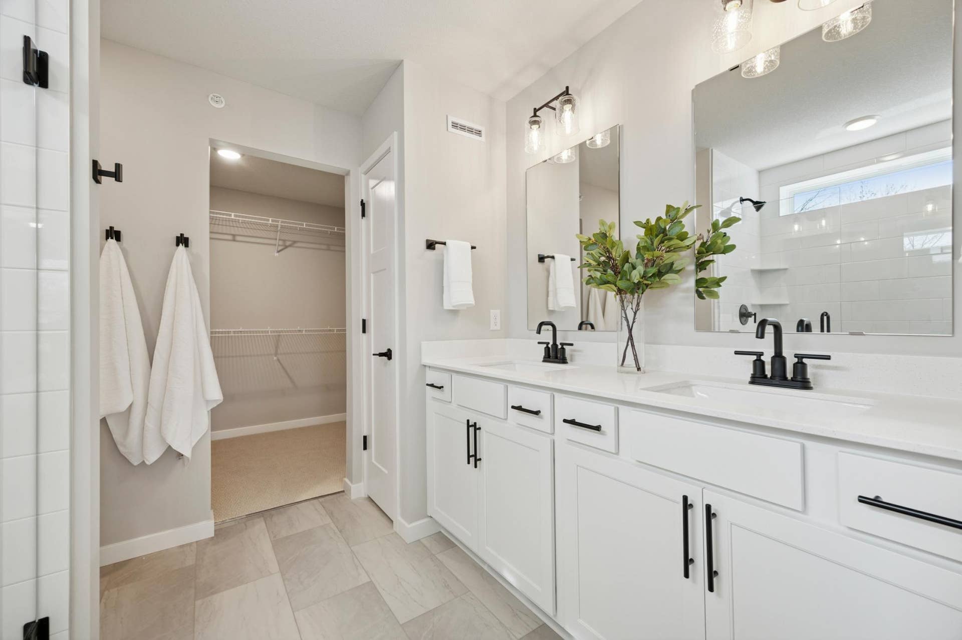 10410 Glacier Lane N, Maple Grove, MN 55369 Primary bath with double sinks and walk-in closet