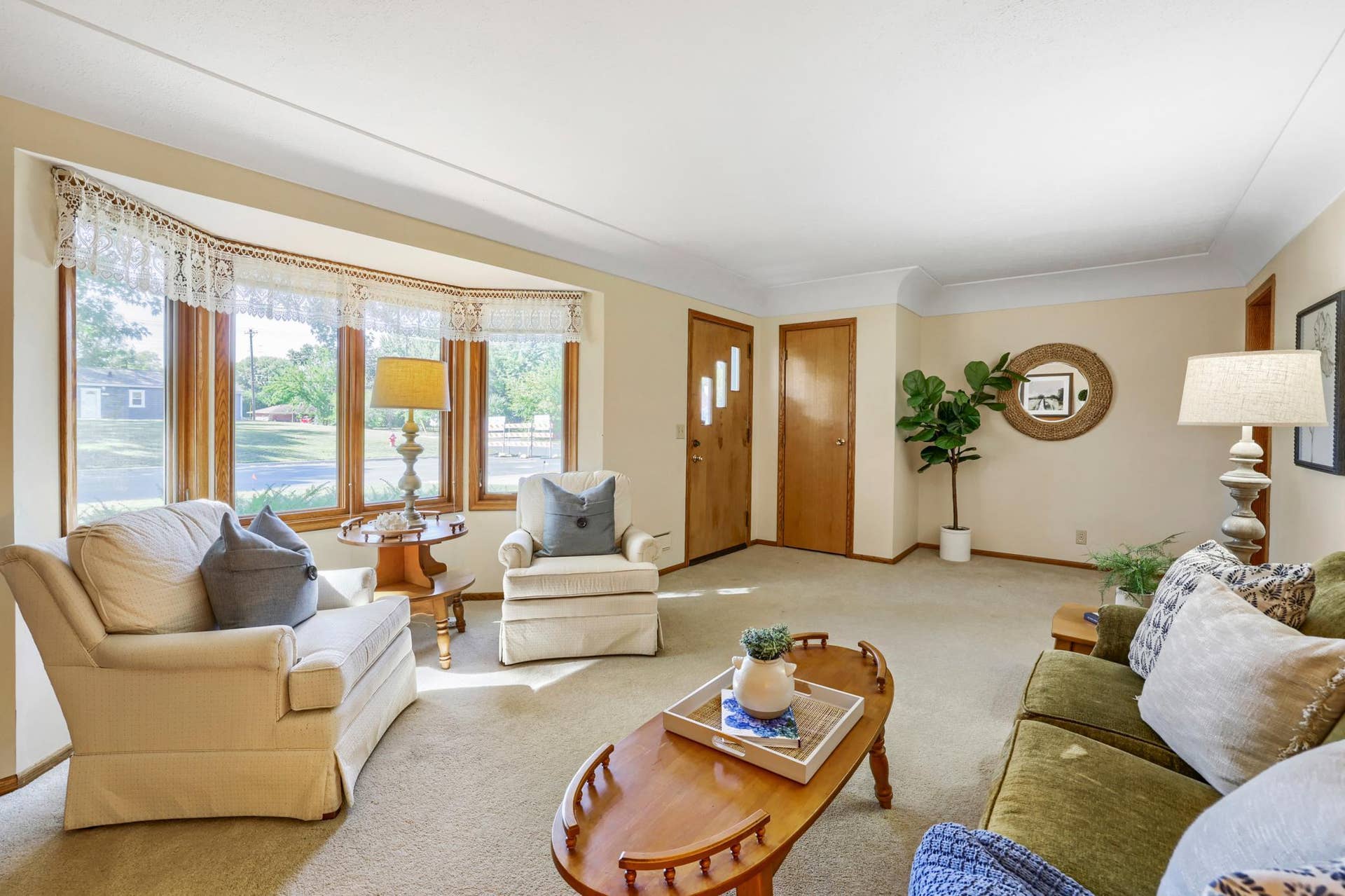 8901 Fremont Avenue S, Bloomington, MN 55420 This spacious front living room is filled with natural light from the large bay window and offers a warm, inviting first impression. The room features classic coved ceilings, generous wall space, and plenty of room for multiple seating arrangements