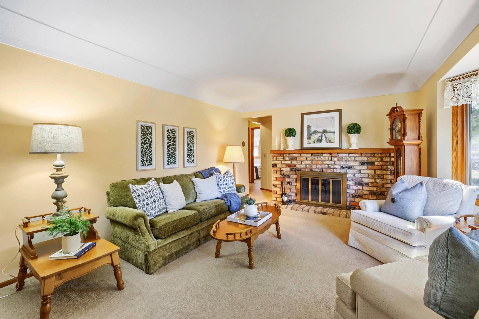 8901 Fremont Avenue S, Bloomington, MN 55420 This inviting living room is anchored by a beautiful brick wood-burning fireplace, creating a warm and cozy focal point for the space.