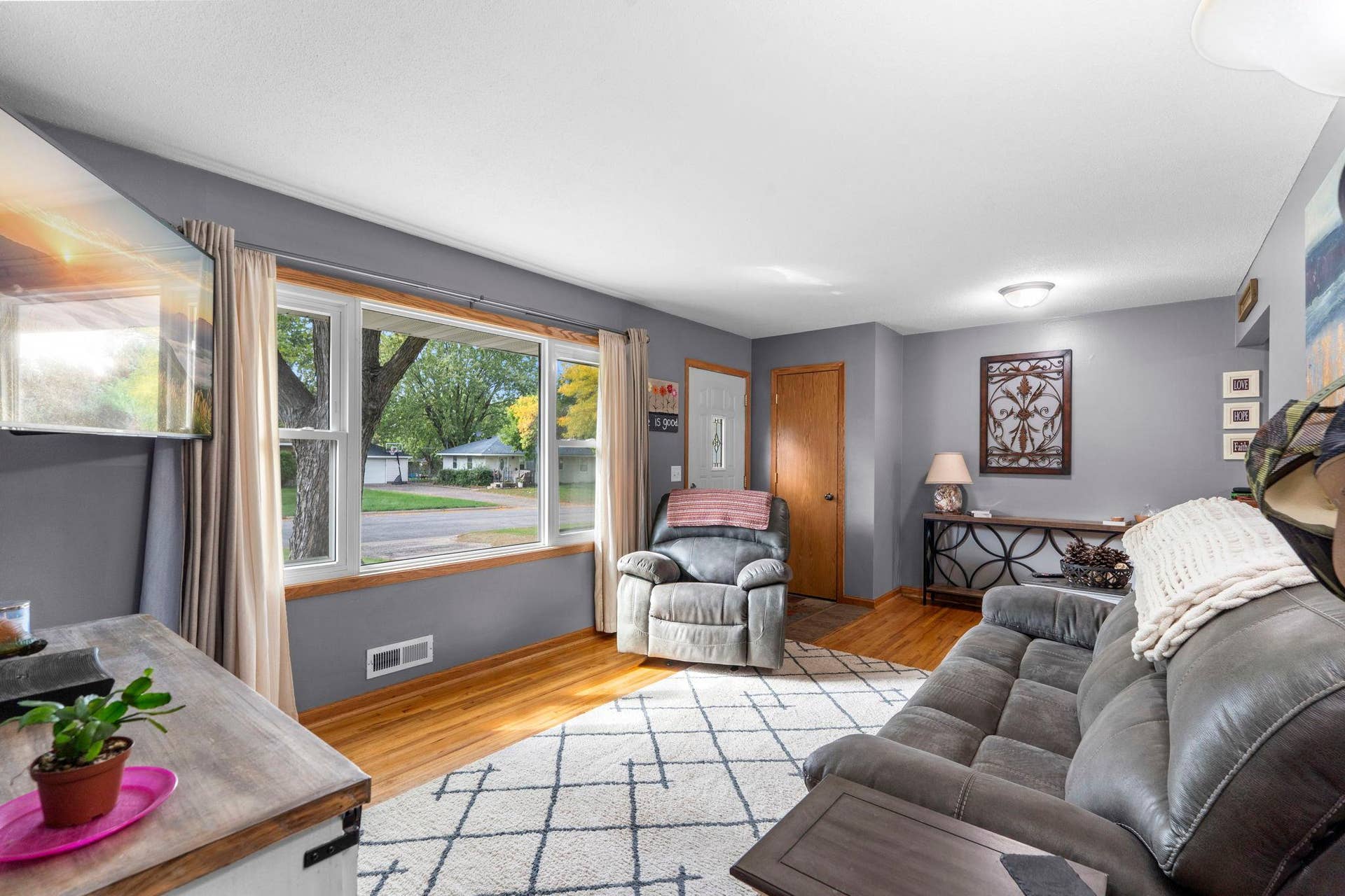 11833 Ilex Street NW, Coon Rapids, MN 55448 A large window adds abundant natural light and an inviting outdoor view to the main living space