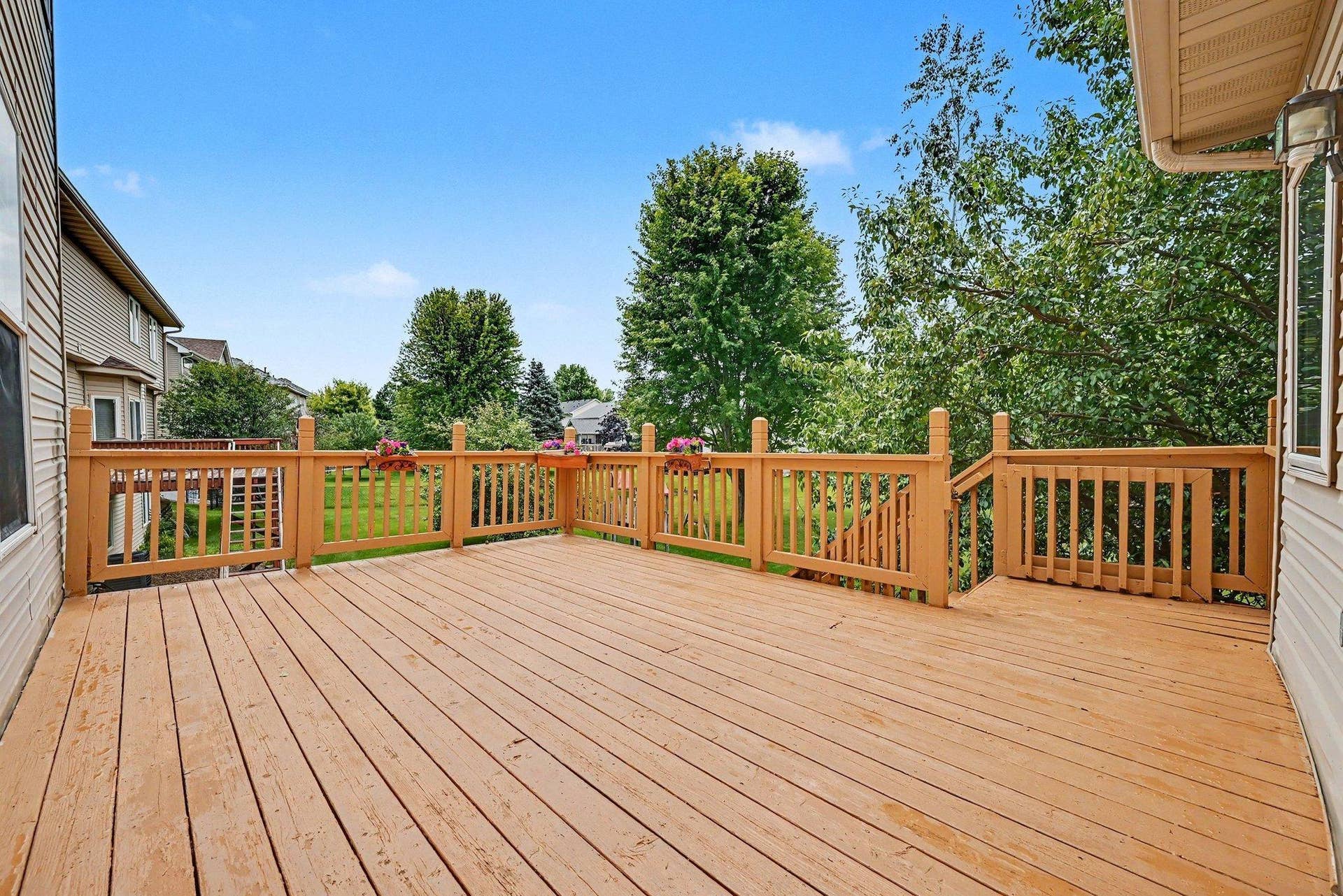 2466 Lone Eagle Trail, Woodbury, MN 55129 Mature trees surrounding the deck.