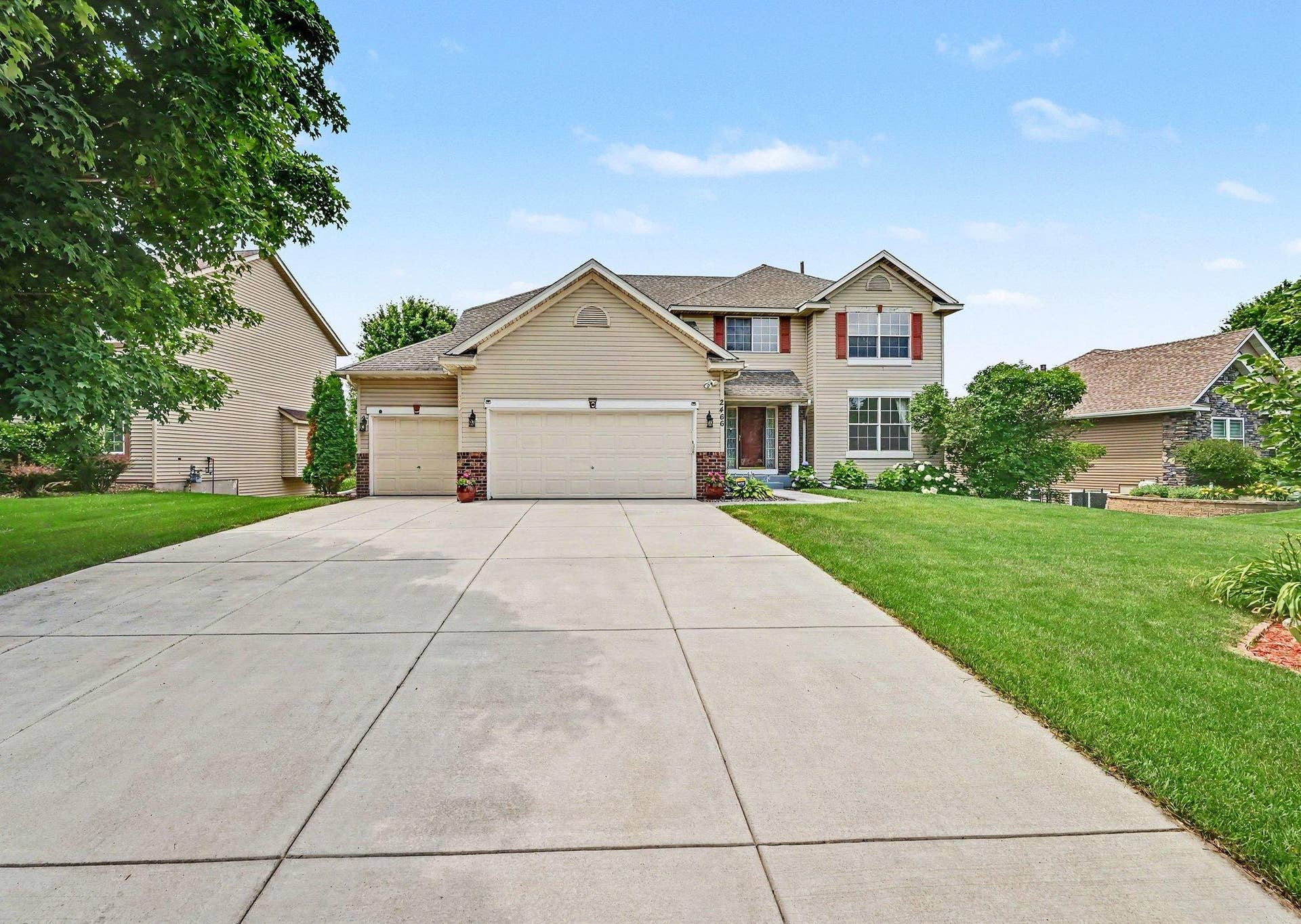 2466 Lone Eagle Trail, Woodbury, MN 55129 Welcome to this Two Story home, situated on a Walkout lot in the golf course community . Brand new concrete driveway.