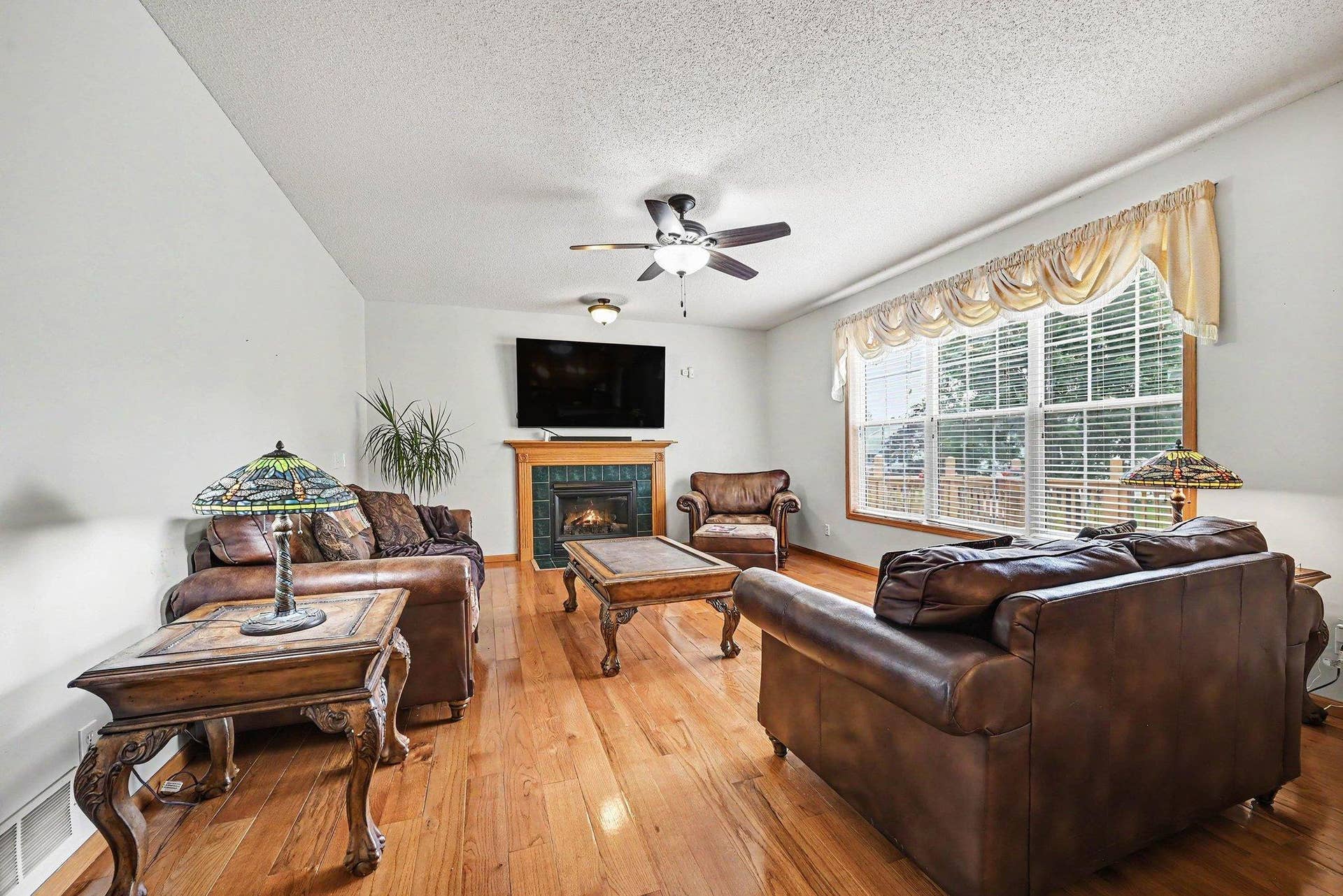 2466 Lone Eagle Trail, Woodbury, MN 55129 Full view of the family room, triple windows , gas fireplace.