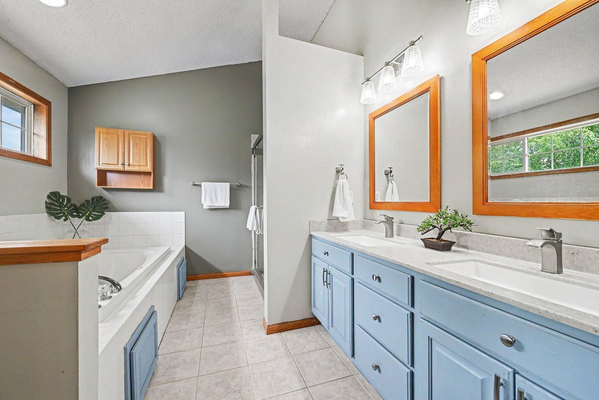 2466 Lone Eagle Trail, Woodbury, MN 55129 Recent remodeled primary bath with double sink, tile flooring, large tub,