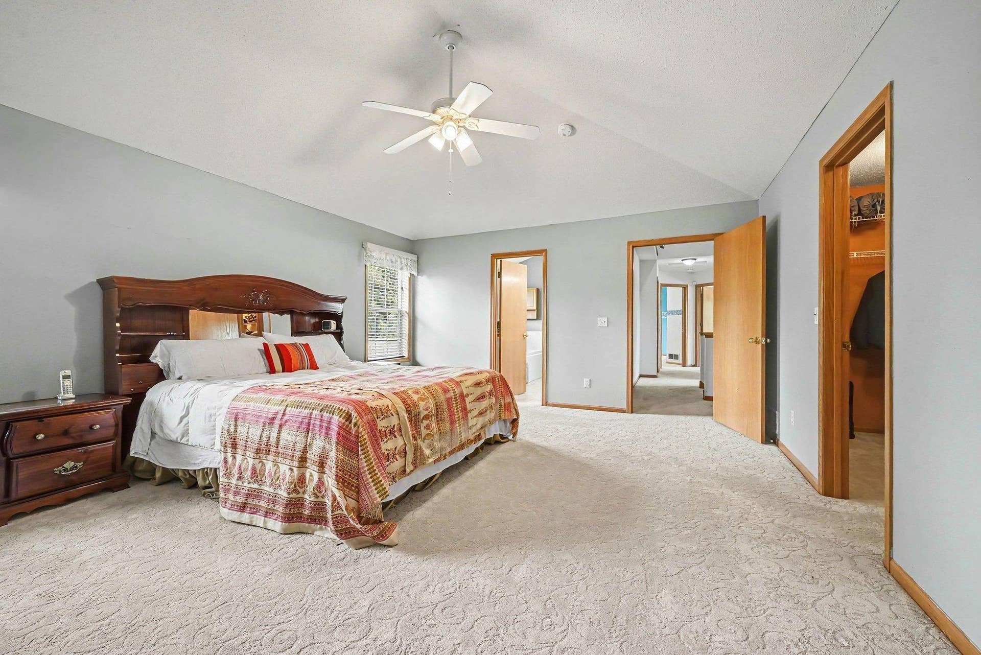2466 Lone Eagle Trail, Woodbury, MN 55129 View of the primary bath, hallway to the other bedrooms and walk-in closet to the right.