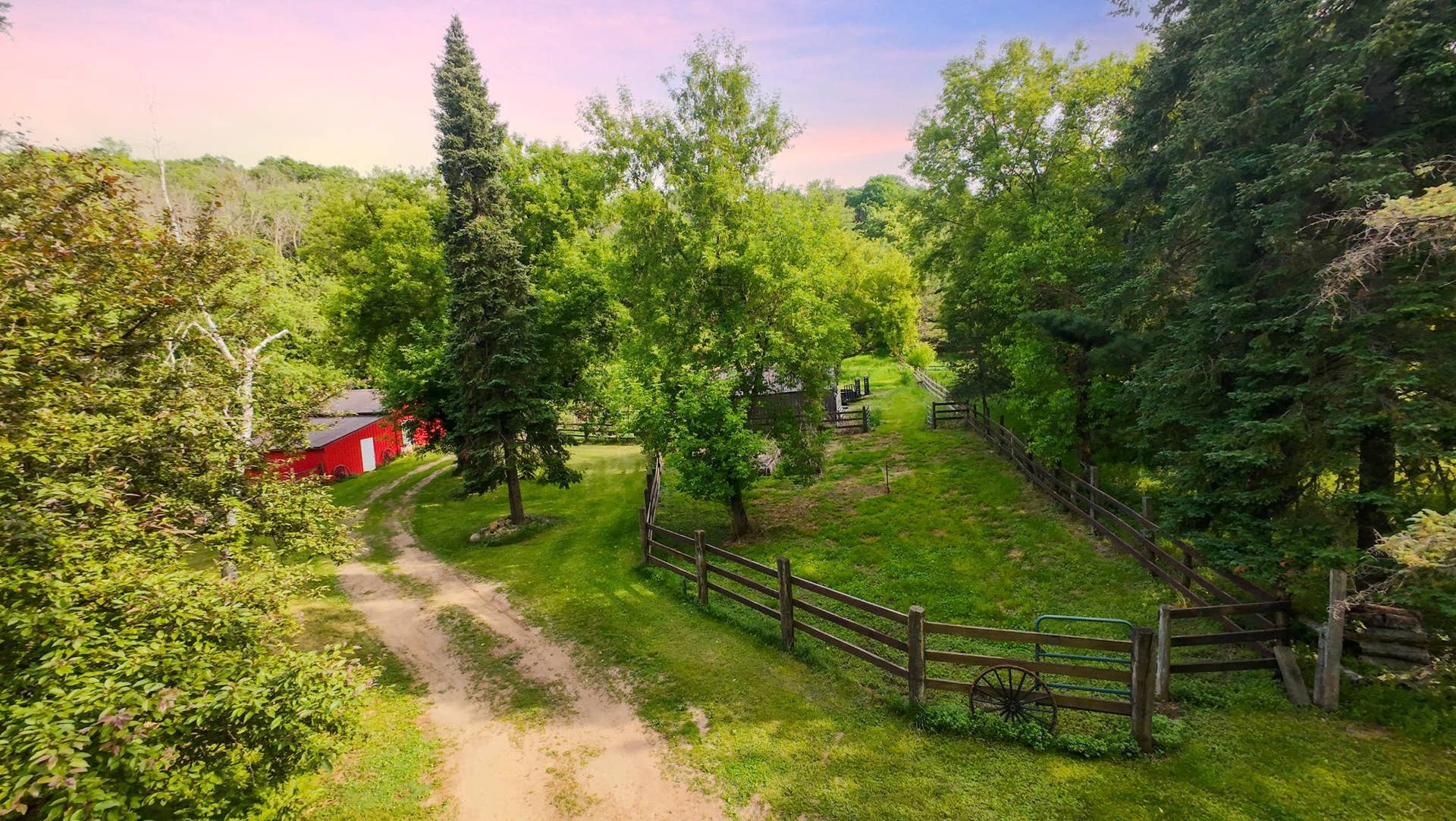 Aerial view of pasture and outbuilding