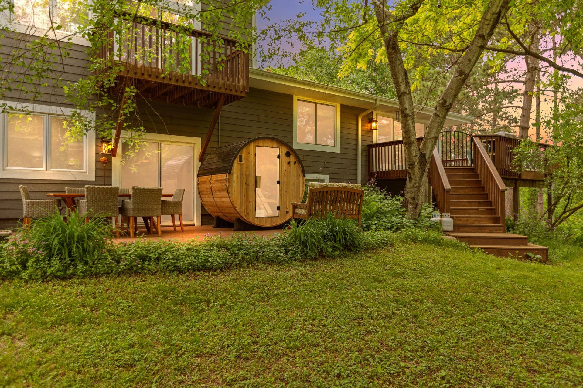 Back of home with patio, deck, sauna, and balcony