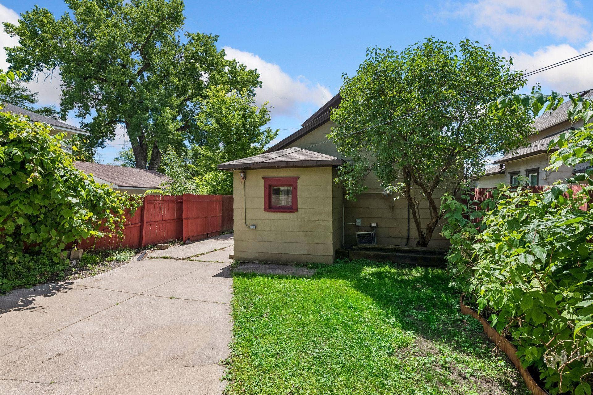 3014 E 26th Street, 67, Minneapolis, MN 55406 Backyard is fully fenced with a roll gate that closes off the driveway.