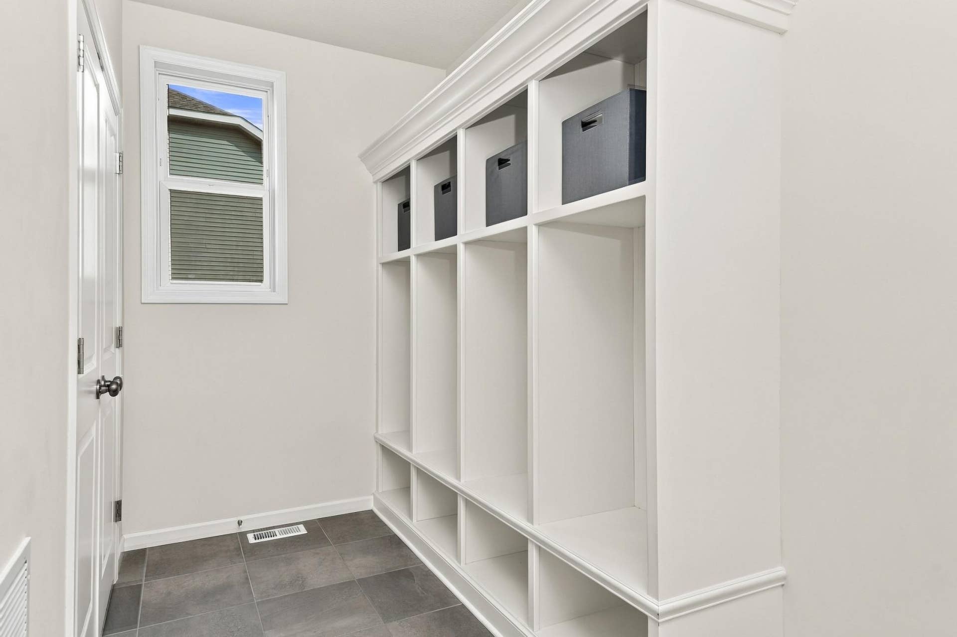 9354 Summerlin Road, Woodbury, MN 55129 Mud room features custom built-ins and closet for additional storage