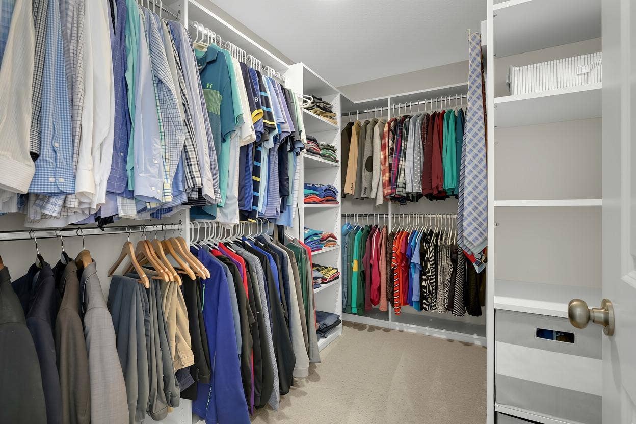 9354 Summerlin Road, Woodbury, MN 55129 Primary walk-in closet with custom shelving