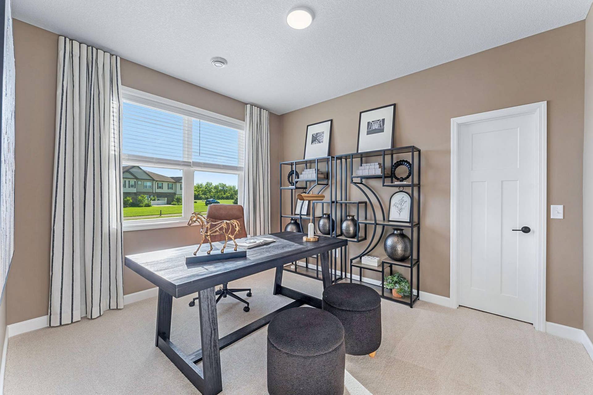 5222 Long Pointe Bay, Woodbury, MN 55129 The flexible nature of the secondary bedrooms makes it easy to accommodate the homeowners evolving needs, whether its a personal gym, art studio or a private office, as its shown here.