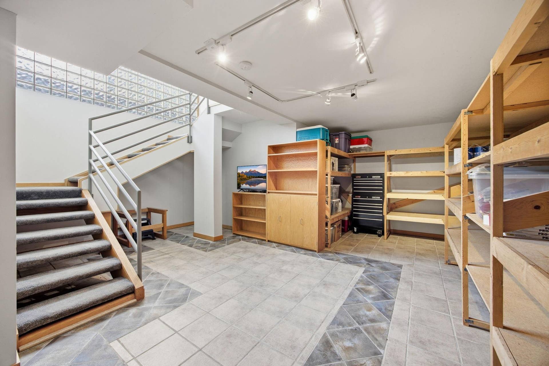 44- Basement is light and bright because of the glass block encased stairwell.