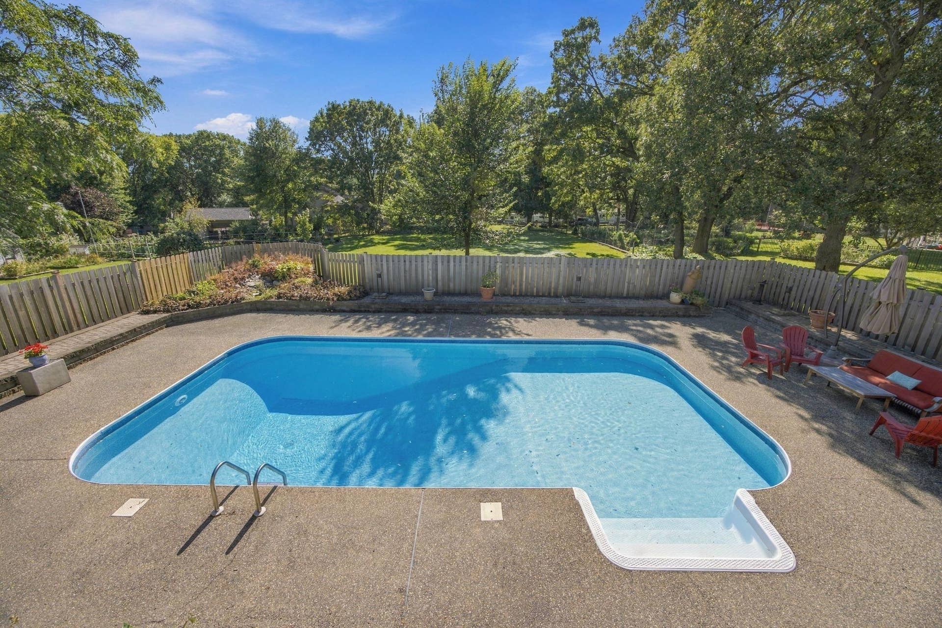 This shows the shallow and deep ends of the pool with plenty of room for seating.