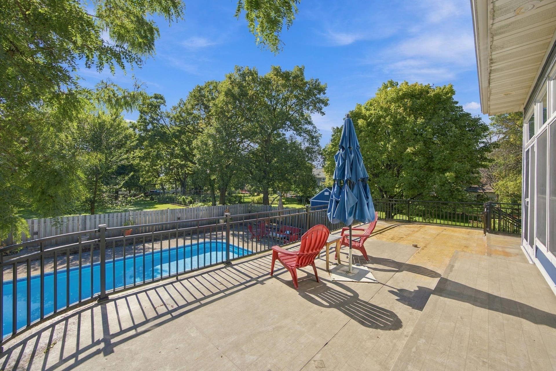 Wrap around deck overlooks pool.