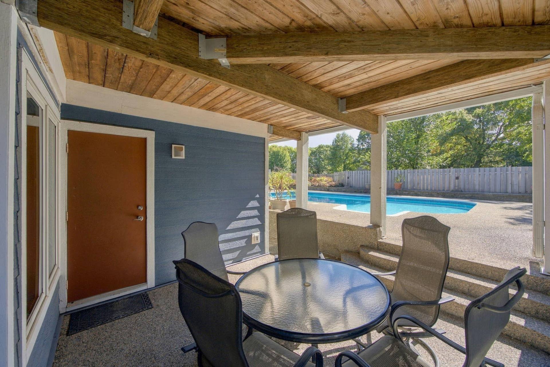 48-  Covered seating area just off lower level family room.